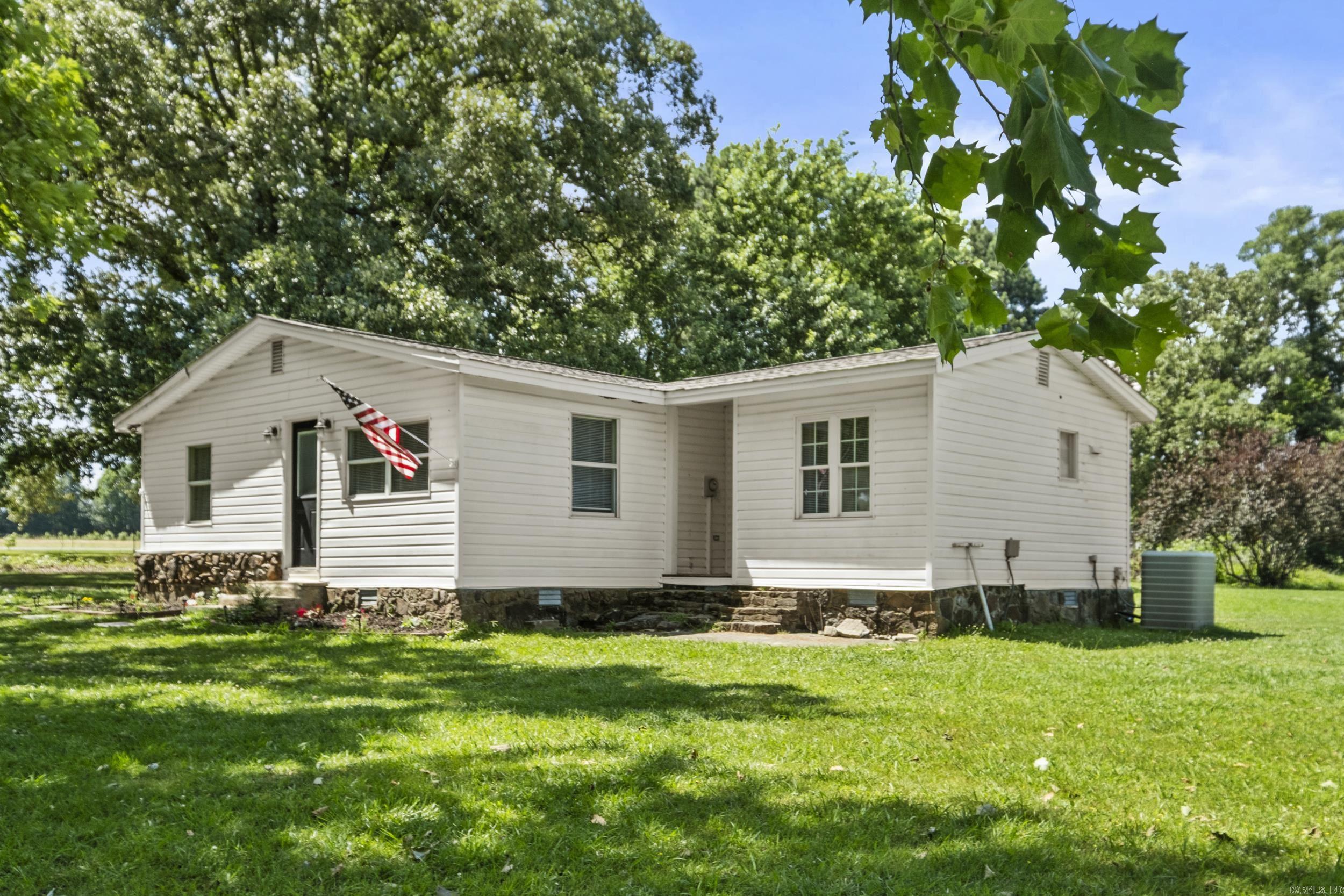 Welcome to this charming 3-bedroom, 2-bathroom home offering 1,672 sq. ft. of living space on 3.43 acres in a peaceful country setting, just minutes from town. Inside, you’ll find a spacious kitchen with plenty of room for cooking and gathering, along with a versatile room just off the kitchen that would make an ideal reading nook, home office, or flex space. The oversized laundry room provides additional storage and functionality, while the large primary suite offers a comfortable retreat at the end of the day. Outside, enjoy the privacy and open space of country living with the convenience of nearby amenities, plus a shed for extra storage. Don’t miss your opportunity to own this beautiful acreage property—schedule your showing today!
