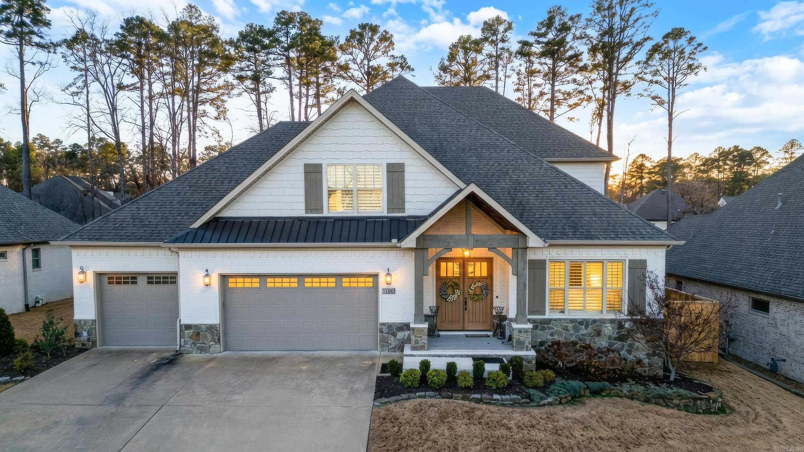 Near Chenal’s Bear Den course - This is an impressive 4 Bed 4.5 Bath w/ a big bonus room and a brand new pool + freshly turfed backyard.   Inside: all new designer lighting + fresh paint throughout, Highly functional plan: Primary + guest suite on main level.   Kitchen highlights big beautiful breakfast island, new splash, a pantry, and additional entry to your wood beam coffered ceiling dining w/ stacked stone accent.   Large living: cozy fire +access to your now screened-in porch w/ 2nd gas fire.  Freshly renovated, flat, and fully fenced turf yard w/ hydrangeas wrapping the hot tub & pool - perfect for  fam & friends.   *This screened in porch does well to keep the gorgeous views while protecting the littles from being able to access the pool until the time is right.*  Privately set apart on main level is coffered ceiling primary w/  dual + knee-space vanity, sleek soaker tub, walk-in seated shower, +spacious walk-in closet.   Also main level: guest suite, w/  private .5 bath, +laundry +shiplap locker stations.   Up: big bonus / playroom w/ playground setup that could stay — as well as the additional 2 Beds & 2 Guest Baths.