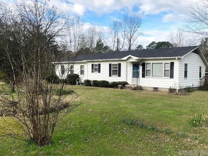 This 4-bedroom, 1-bath is a great starter home. It sits on a huge corner lot in the heart of town. Construction of a second bath in the primary bedroom has been started. A little TLC will bring this one back to its former glory. Property is being sold AS-IS. Square footage, lot size, and acreage is taken from courthouse records.