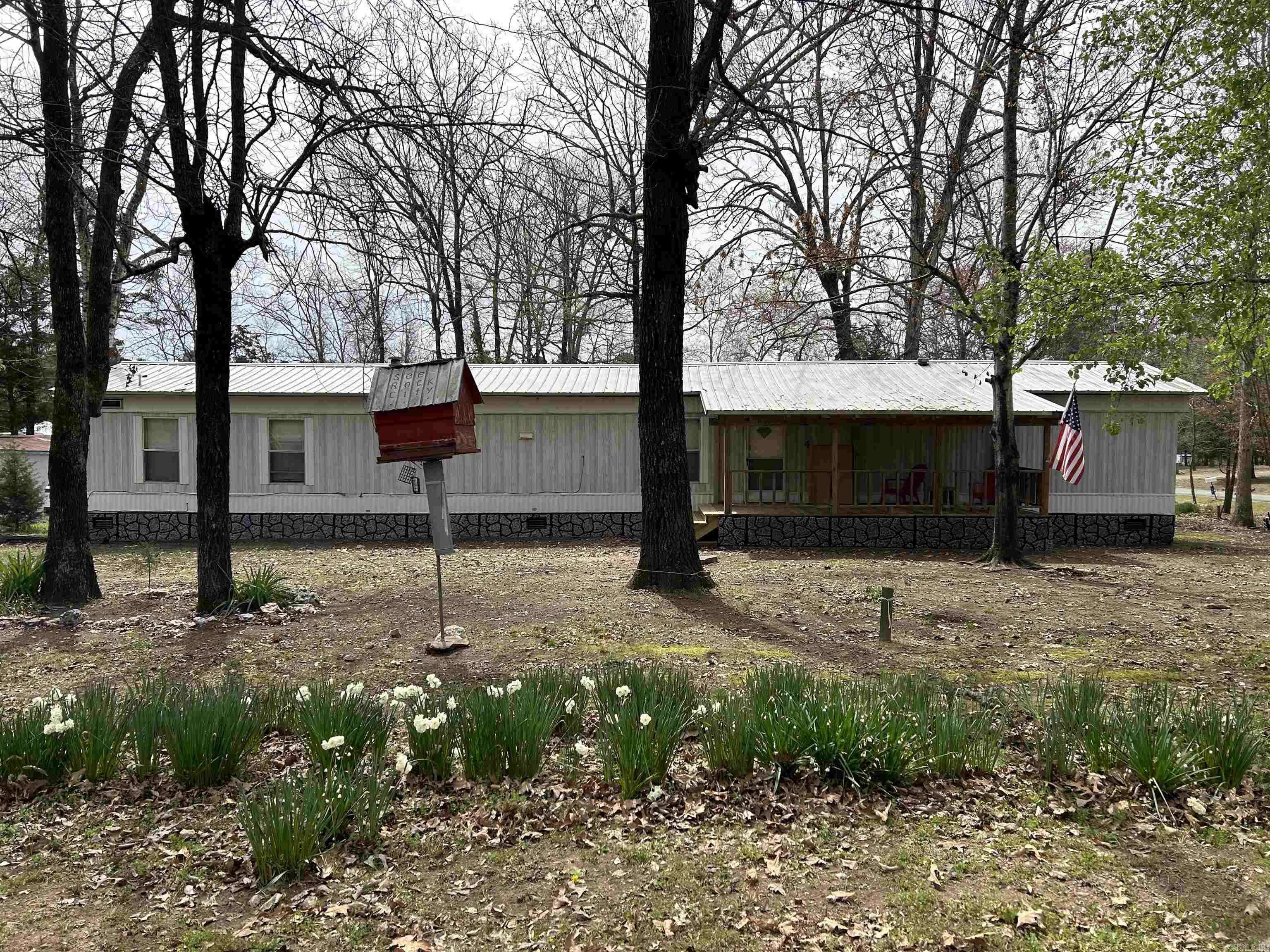 If you have been looking for a home at Greers Ferry Lake, look no further. This 3 bedroom, 2 bathroom home is up-to-date and comes fully-furnished. Whether you are looking for a vacation home or an investment property, this could be the right fit for you as it has been a successful short-term rental for the past 2 years! There is also a guest house on the property with a lean-to that already has hook-ups and septic for a camper. With a little TLC it could be a very functional 2 bed, 1 bath house! The property sits right off of Old Highway 25 and is approximately 1 mile from lake access, a boat, ramp, and a great swimming area! *This property is agent owned*
