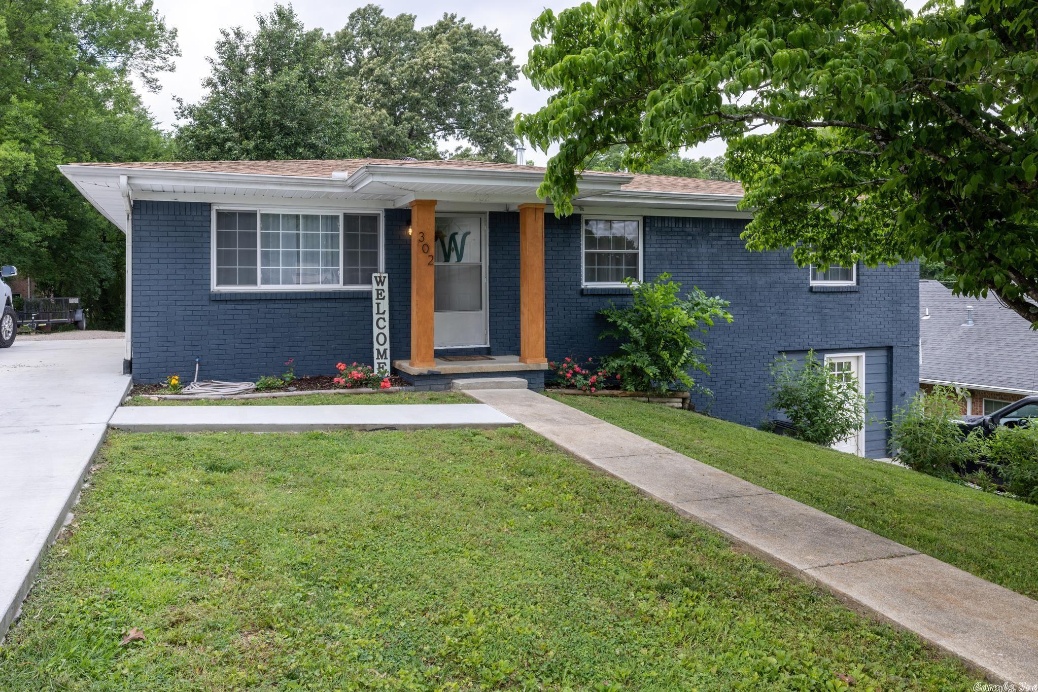 Beautiful brick home close to school in Hot Springs. This 5 bed 2 bath home has been completely remodeled from head to toe. The finished basement features 2 beds, beautiful full bath, and den area with full kitchen. This would make an amazing Mother in Law Suite or man cave. Upper level features and additional 3 bed and 1 full bath with open updated kitchen and spacious dining room that leads out to a beautiful deck over looking a large yard.
