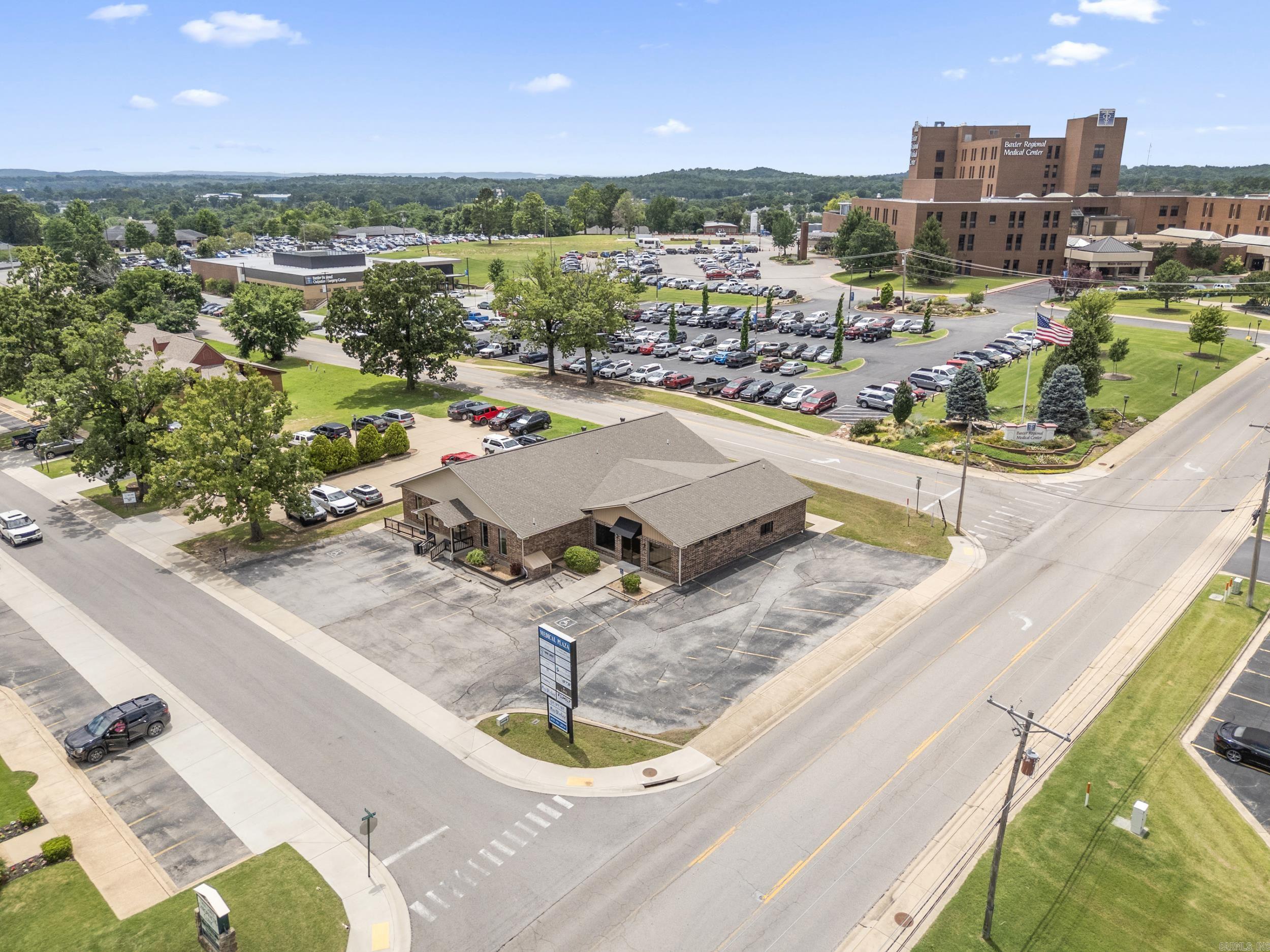 You can’t beat the location of this exceptional medical office—just steps from the hospital in a high-traffic, high-visibility area. Spanning over 5,000 square feet, this well-designed facility offers everything needed for a successful healthcare practice. Inside, you’ll find a spacious waiting and reception area, multiple exam rooms, a large family restroom, a generous break room, and ample storage space throughout. Situated on a prime corner lot, this property is perfectly positioned for patient convenience and professional visibility. Don’t miss the chance on this premium medical building in a sought-after location—schedule your private tour today.