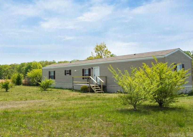 Unique opportunity to own a 3 Bed/2 Bath home on 2.8 Acres!! Approximately 5 mins to the NLR and 15 mins to Downtown LR. Come see this 2013 model mobile home remodeled with New Carpet & Fresh Paint! Beautiful land mostly cleared on quiet street. Hosts a Gourmet Kitchen with several Built-ins, Master Bath Suite with Jacuzzi Tub, and Split Floor plan. This home is a True Beauty and Affordable - Seller may finance.