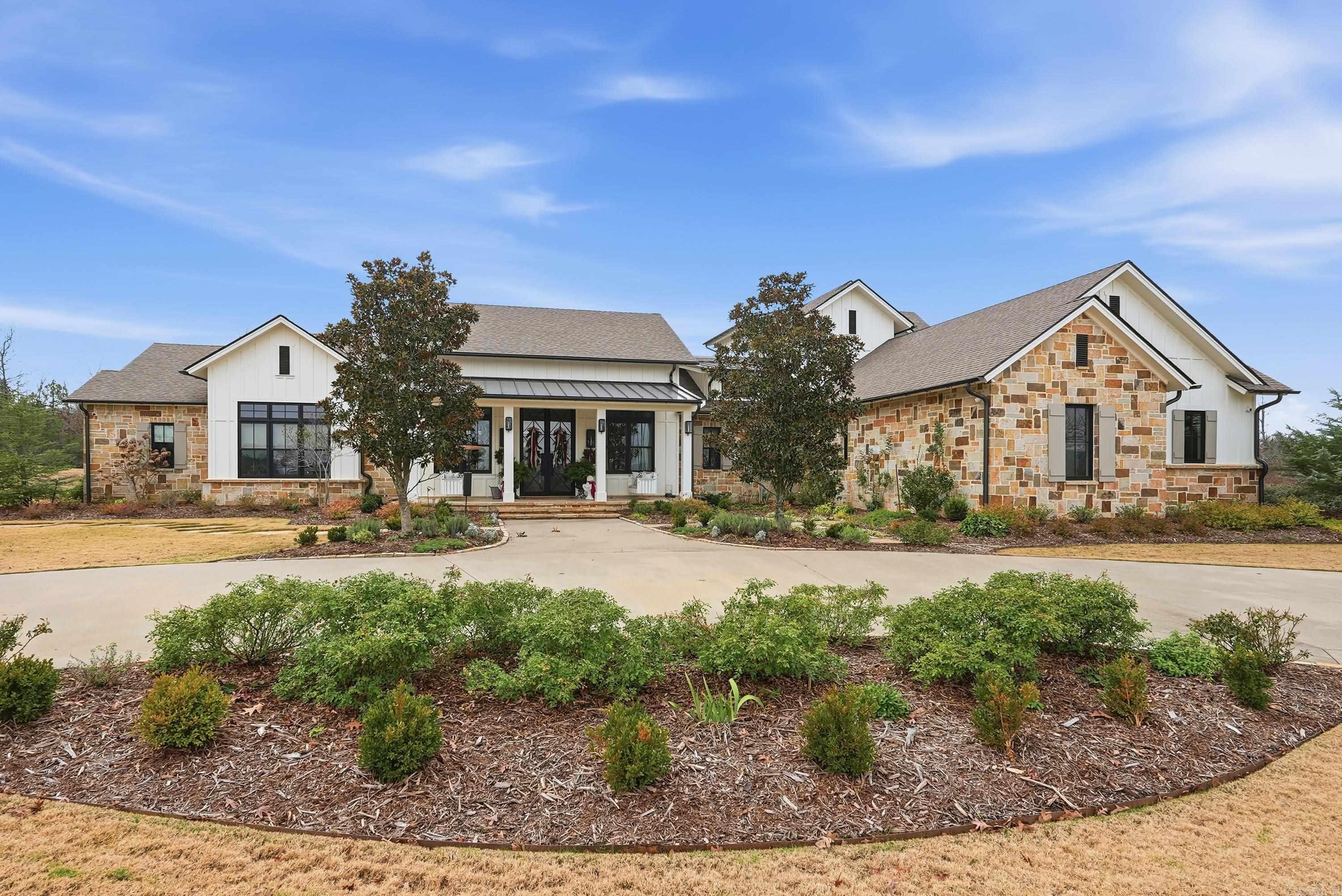 Extraordinary 40-acre gated luxury estate offering privacy, resort-style amenities, and multiple living structures. Built in 2017 and fully remodeled in 2024, this amazing property features exceptional craftsmanship, energy efficiency, and versatility - ideal for a family compound, equestrian estate, or luxury retreat. The 4,959 sq ft main residence offers custom features, hardwood floors, 4.5 baths with en-suite bedrooms, a flexible bonus space, dual laundry rooms, storm shelter, and a spa-like primary suite with heated floors. Screened porches overlook a saltwater pool & spa, perfect for entertaining and private relaxation. The grounds include a stocked 1.5-acre pond, fenced open acreage, and gated entry suitable for livestock or horses. Additional structures include a 3,000 sq ft heated & cooled barn with kitchen & 1/2 bath, event space & workout room. Also included is a barndominium (3700 sq ft, heated & cooled) with finished living quarters, as well as a 40x60 pole barn for storage or equipment. A rare luxury country estate combining modern systems, multiple dwellings, pond, pool, and expansive acreage with turnkey improvements.