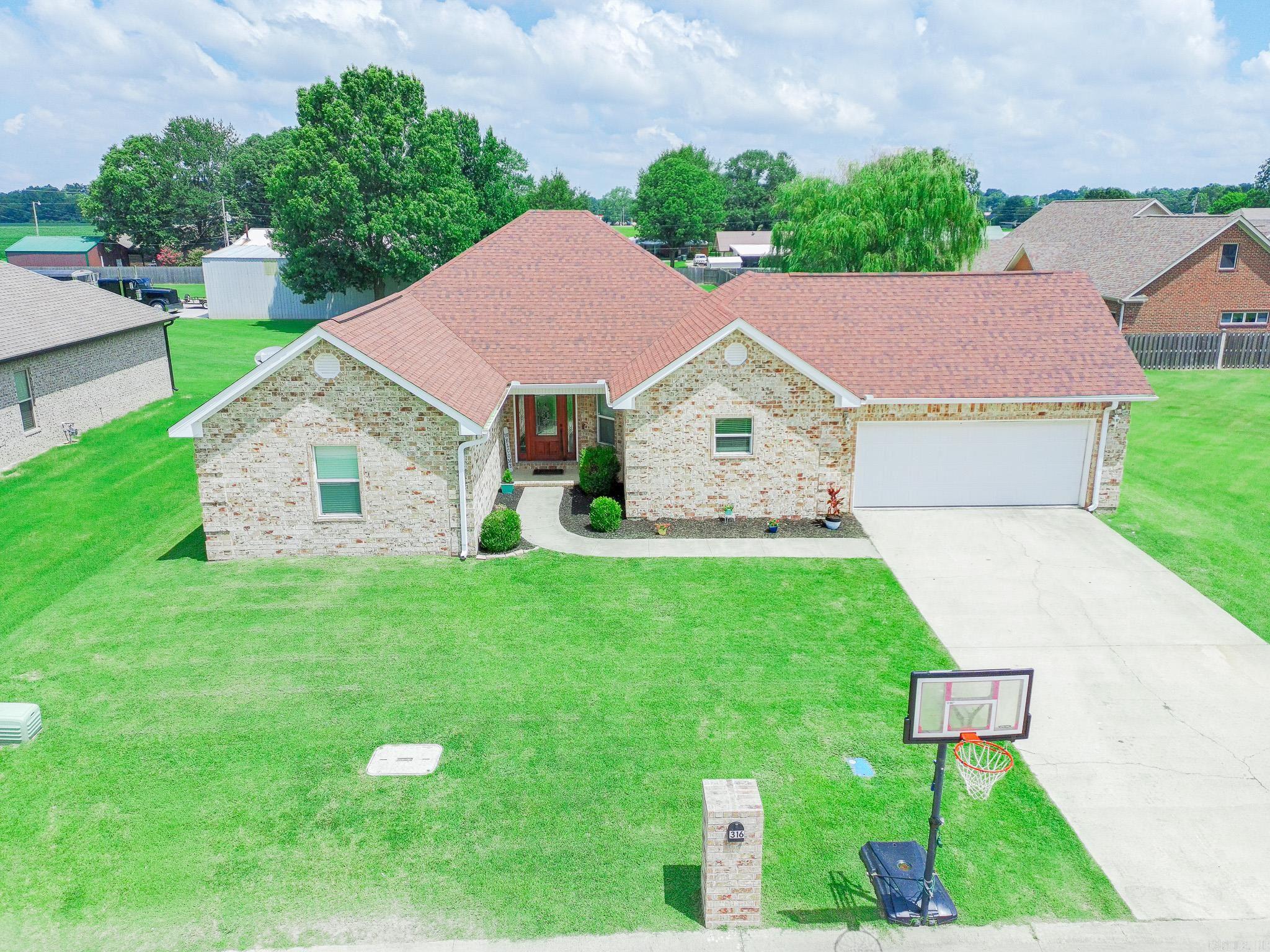 Welcome to 316 Pintail Drive in Bay, Arkansas! This well-maintained, one-owner, all brick home offers approximately 2,087 square feet of heated and cooled living space with 4 bedrooms, 3.5 bathrooms, and a desirable single-level floor plan. Designed for both comfort and convenience, the home features durable acid-stained concrete flooring throughout for a modern look and low-maintenance living. The spacious layout includes an attached two-car garage, central heat and air, and an all-electric design. Step outside to enjoy the privacy-fenced backyard, perfect for relaxing, entertaining, or pets. Located in the established Southpointe Acres Subdivision and within the Bay School District, this property offers the charm of small-town living while remaining just approximately 10 minutes from Jonesboro, providing quick access to shopping, dining, medical facilities, and employment opportunities. If you're looking for a move-in ready home with space, quality construction, and a convenient location, this one deserves a place on your must see list.