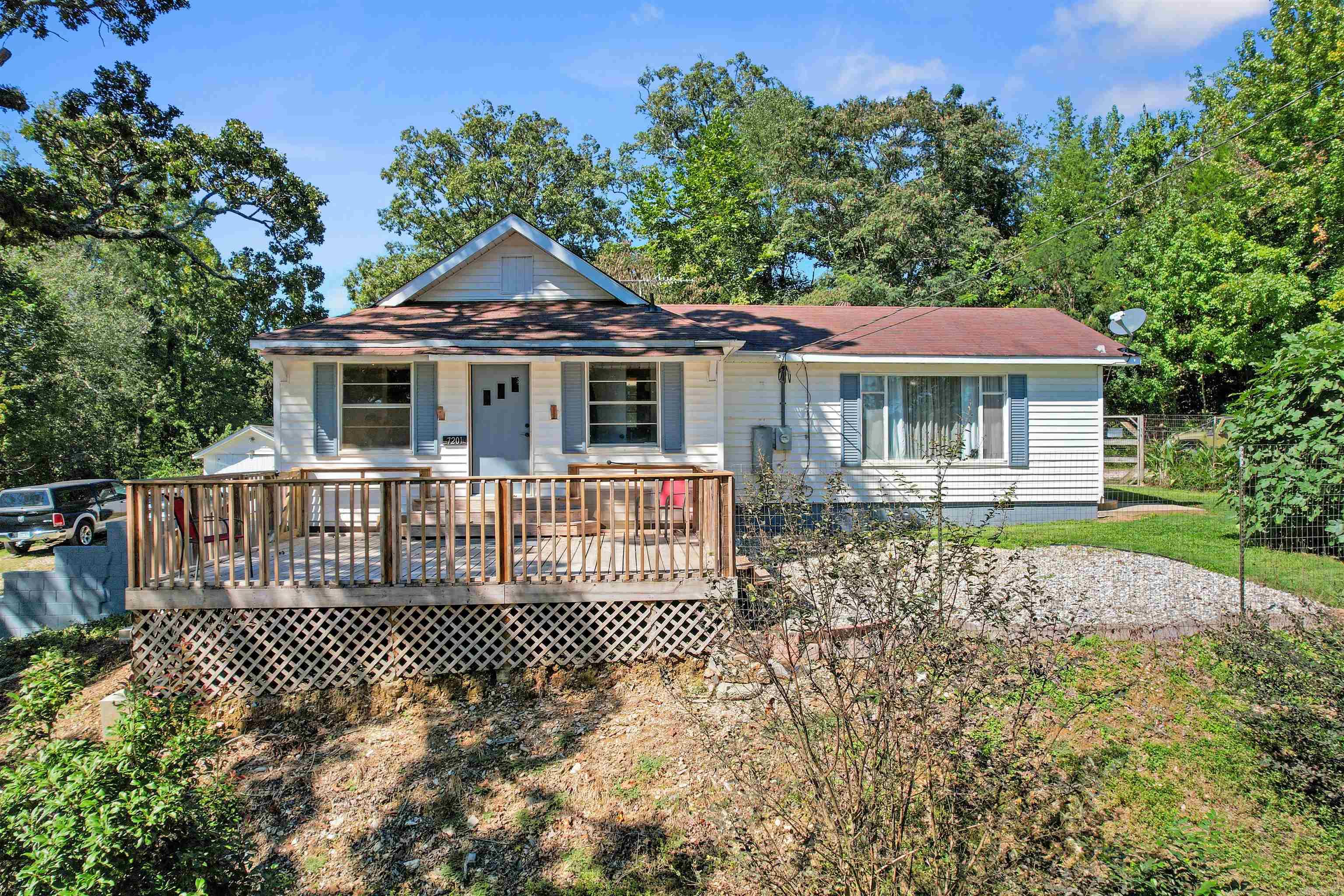 This remodeled home blends historic character with today’s comforts, just minutes from downtown Hot Springs and major highways.  Inside you’ll find 2 bedrooms, 2 baths, a flexible office (or extra bedroom/game room), a cozy kitchen/dining area, and a bright den with large windows overlooking the yard.  The fenced backyard features a new deck shaded by majestic oaks, creating the perfect spot for kids and pets to play. The property also offers pear, peach, plum, and fig trees, giving you fresh fruit right at home. A detached garage, storage building, and drive-through carport add convenience.  Enjoy peaceful country living with easy access to city amenities!