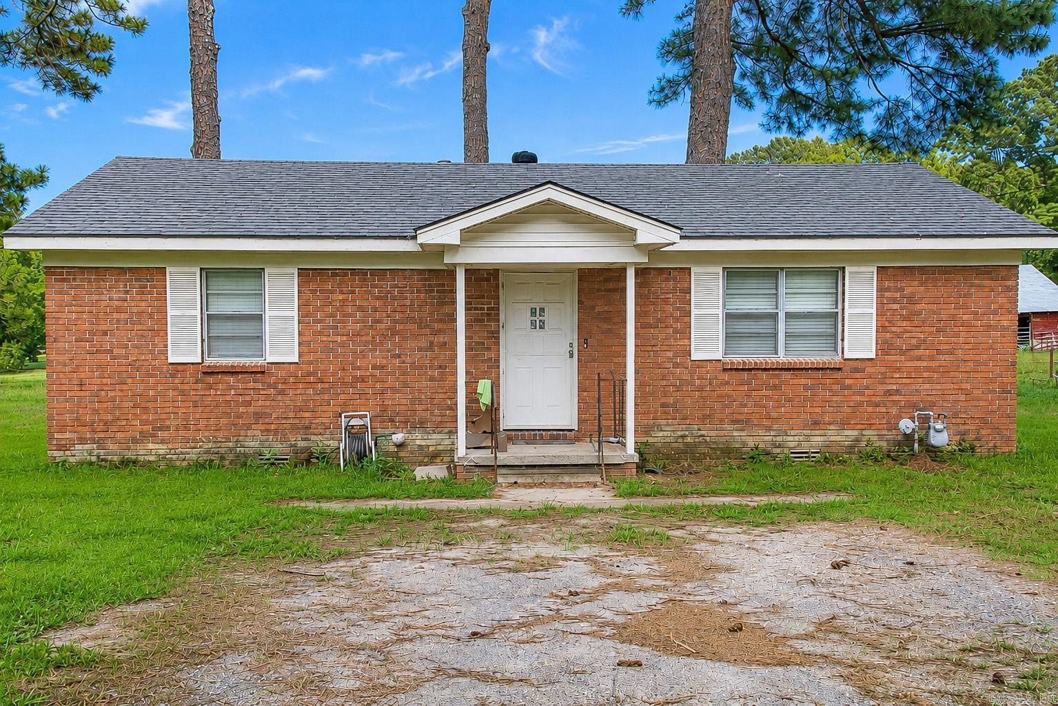 ATTENTION INVESTORS OR FLIPPERS ALIKE! Great bones in this brick 2BR 1 BA home sitting on almost a half acre. Needs some TLC...great opportunity for the right buyer! Roof (2015) A/C (2018).