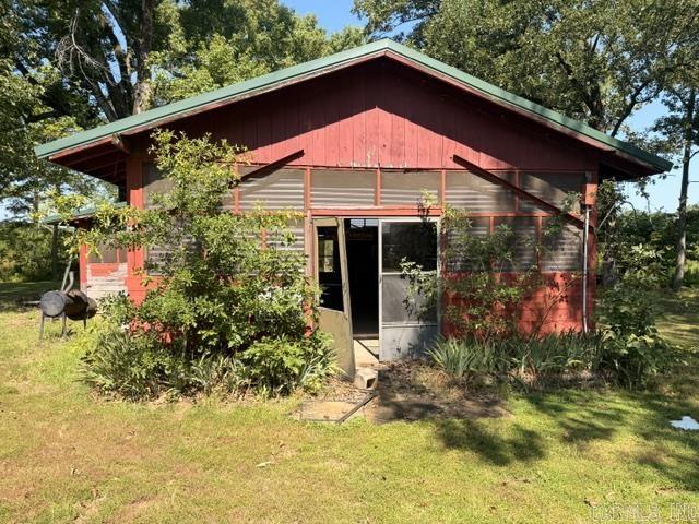 Can be sold as Commercial or Residential property. ON LAKE CONWAY Sitting on a little over 2 acres of cleared & wooded, beautiful level, waterfront private property.  Property is set up with 25 RV electric and water hook-ups (30 amp) camping spots. When new damn site is finished will have wider fishing channels for larger boats and fish.   Enjoy boat launch with large dock bigger than what restrictions are now, fish cleaning station, dump station, large pavilion with kitchen, men and women's restroom with showers, small house heated and cooled with bedroom, kitchen and bath, picnic tables (some covered) Buildings do need some repairs and updating. Everything conveying with property. This is a rare find with endless opportunities such as, keeping as is, Airbnb, building a home, private retreat, fisherman's camp..... No disclosure being sold as is.