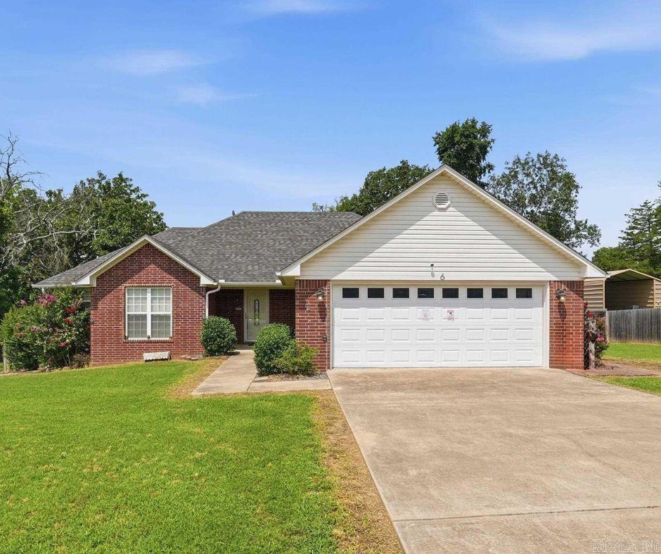 Move-in-ready brick home in Greenbrier featuring an open living, kitchen, and dining area with a desirable split floor plan, three bedrooms, and two full bathrooms. Fresh paint throughout, no carpet, new luxury vinyl plank flooring, and tile in the wet areas make this home easy to maintain.  Some rooms have been virtually staged so you can imagine yourself in this home. Additional features include an electric fireplace, granite countertops, rich cabinetry, stainless steel appliances, and a spacious primary suite with a double vanity, tiled walk-in shower, and large walk-in closet that also serves as an in-home safe room. Outside, enjoy a covered back deck, fenced backyard, storage building, and play area on approximately half an acre—perfect for entertaining, relaxing, kids, and pets.