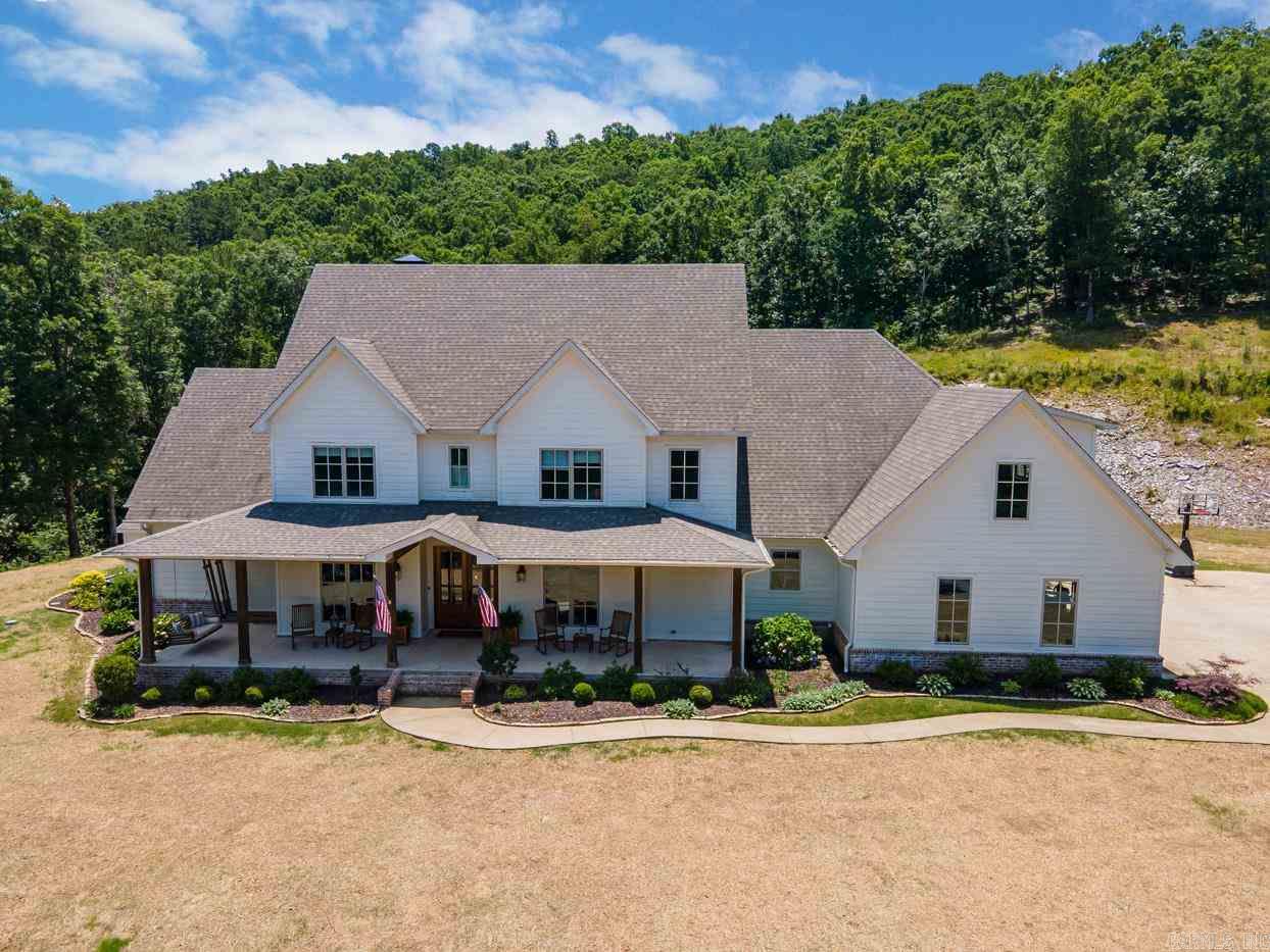 Custom-built in 2015, energy-efficient 5BD/4.5BA home in gated community. Nestled on 16 private acres. Beautiful hardwood floors, gourmet kitchen w/ genuine quartzite countertop, large bonus room. NewAire system heats house off fireplace, storm shelter, chicken coops, custom playhouse. Want to work from home? No problem! Fiber internet and workshop/office off garage.  Only 15 min. to the Promenade!