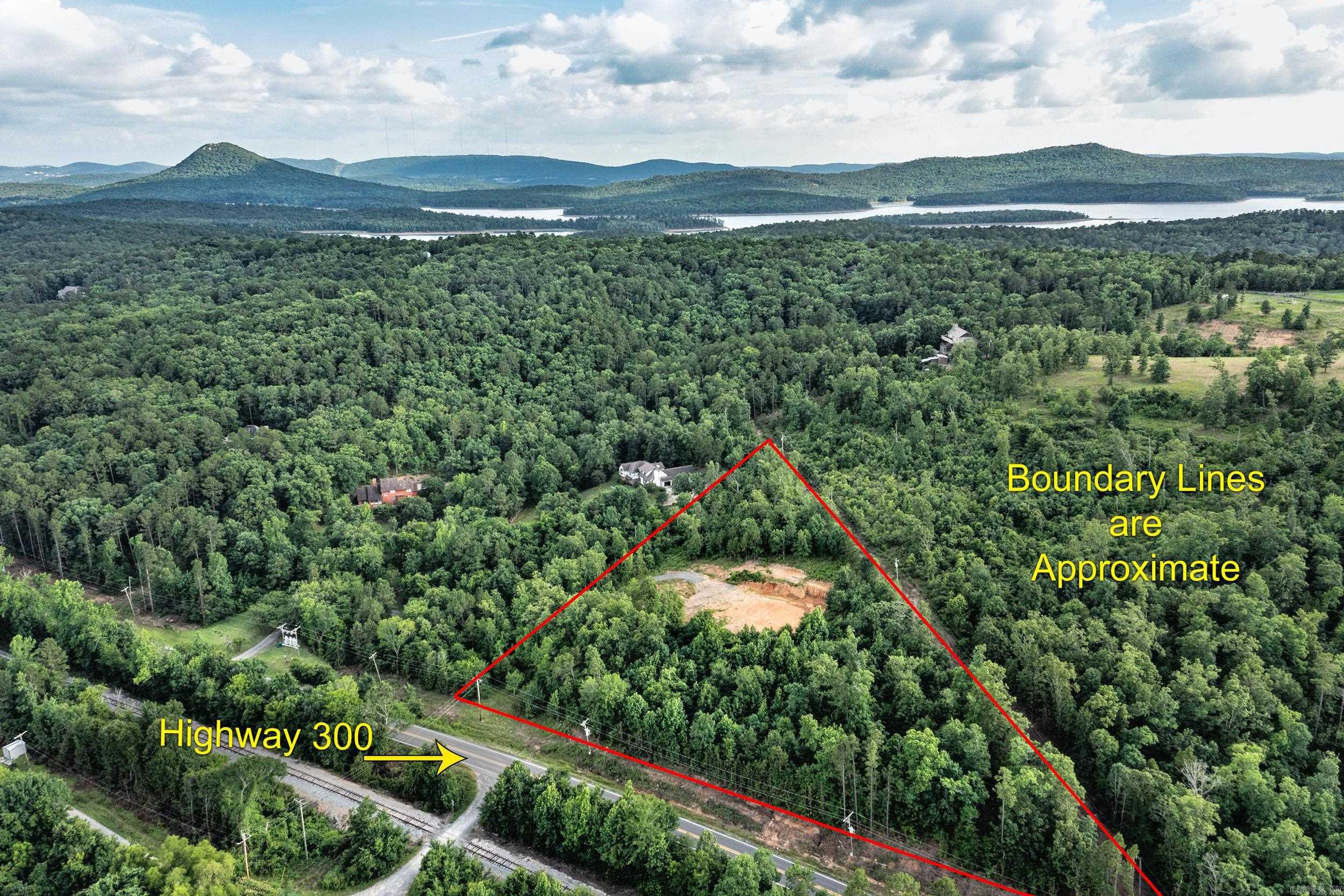 Less than 10 minutes from Wal Mart on Cantrell and Chenal parkway, this lot has already been cleared and driveway is in!  Roland Water and electricity present.  Builder owned with plans and building coordination available. Perk test has been done and approved by the health department.