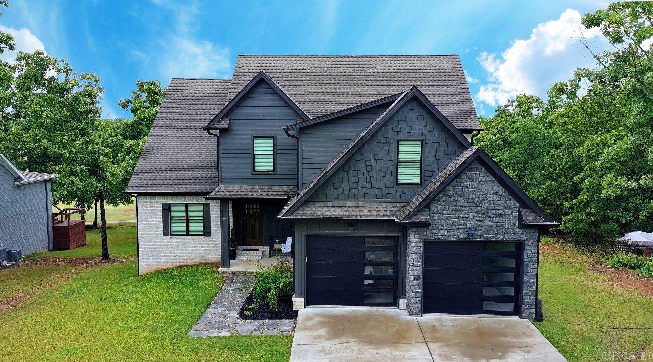 Welcome to a custom built showstopper in Greystone perfectly positioned on the golf course near Cypress Creek Golf Club. Built in 2022 this home offers over 3000 square feet of thoughtfully designed living space with 3 bedrooms plus a media room that can easily function as a 4th bedroom along with 3.5 baths. From the moment you walk in the open layout and expansive windows draw your eye straight to the 10th fairway creating a seamless indoor outdoor feel. The kitchen is a true centerpiece with a massive island quartz countertops and a custom walk in pantry designed for both everyday living and entertaining. Wood beams and ceilings add warmth while the fireplace creates a cozy focal point. Step outside to your outdoor kitchen and fireplace perfect for hosting or unwinding after a day on the course. Additional features include a golf cart garage with extra storage and a striking black and stone exterior that sets this home apart.