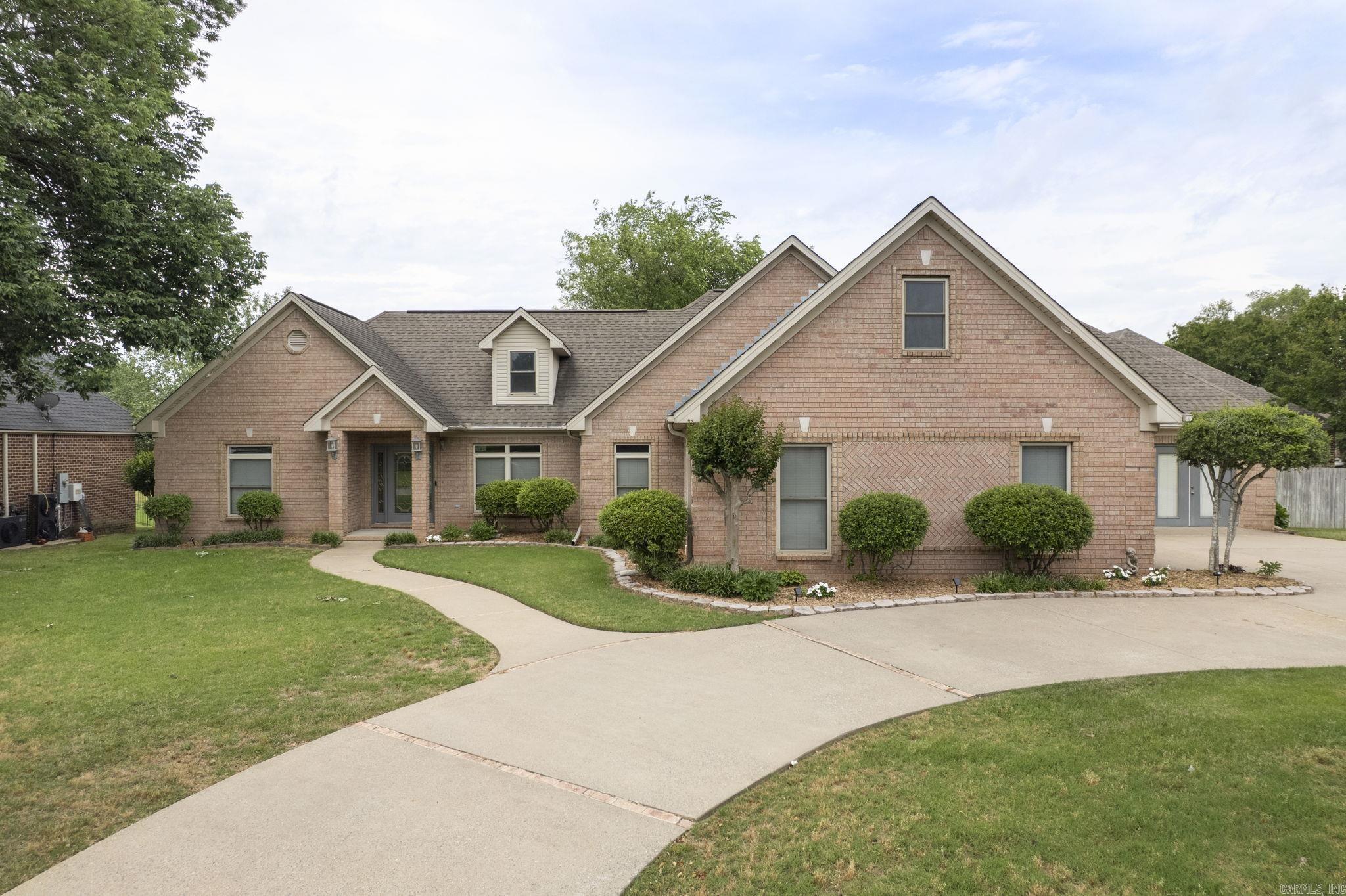 Nestled in the desirable Hurricane Lake Estates subdivision in Benton and located within the highly sought-after Bryant School District, this 3-bedroom, 2.5-bath home offers the perfect blend of comfort, functionality, and scenic lake living. The open floor plan creates an inviting atmosphere with a spacious living area featuring a cozy fireplace and seamless flow into the oversized kitchen—ideal for entertaining or everyday living. The half bath is a safe room. The primary suite offers a relaxing retreat with a private en-suite bath and walk-in closet, while the bonus room provides flexible space for a home office, playroom, or media room. Step outside to enjoy the covered patio overlooking Hurricane Lake, perfect for morning coffee or evening sunsets. The fenced backyard adds privacy and space for pets or outdoor gatherings and take advantage of your own place to dock a boat. Don’t miss this opportunity to enjoy lakefront living with convenient access to shopping, dining, and schools. Some photos have been virtually staged. Buyers to verify lot size using their own measurements.