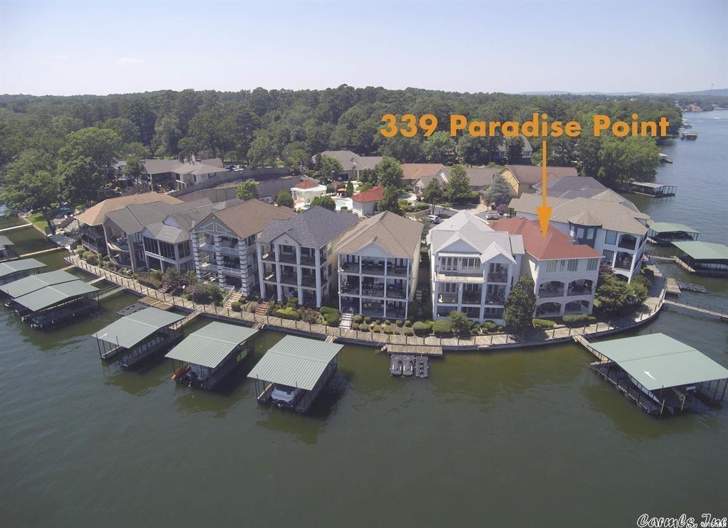 Lake Hamilton Townhome, Impressive Main Channel views. Tri Level with large kitchen, breakfast bar and dry bar. Laundry on upper &lower levels. Two living areas, 4 Bedrooms/4 Baths and One 1/2 Bath. Large Walk in Closets. High end appliances, Upscale subdivision, Gated entrance, pool and club house. Double covered boat dock/wave runner slip conveys. This gorgeous home speaks for itself, you will not want to look any further! All furnishings convey with some exceptions. Call show today 501-321-6166