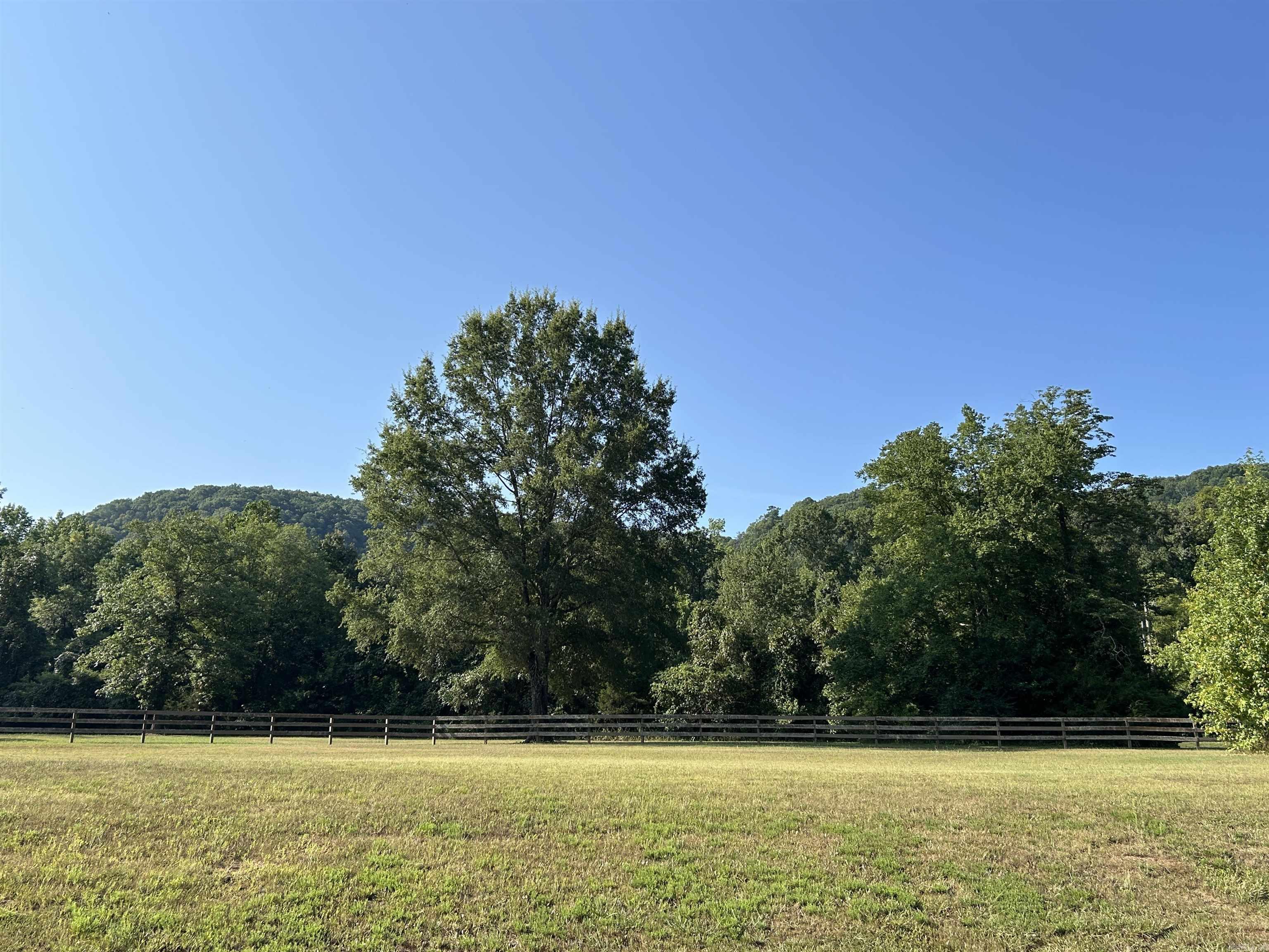 **Premier Lot in Rivers Edge Subdivision** Discover the finest vacant lot in Cleburne County, a rare gem in the prestigious Rivers Edge Subdivision. Close proximity to the Little Red River, this exquisite lot offers unrivaled luxury and natural beauty, perfect for your dream home. Backing up to a lush green area, it ensures privacy and stunning views of Libby Bluff with the soothing sounds of the river just steps away. The subdivision is adjacent to a public launch ramp at Lobo, enjoy world-class fishing and boating on the pristine Little Red River. Rivers Edge redefines upscale living with gated entry for security and exclusivity. Savor premium amenities: a community boat dock for waterfront adventures, a sparkling pool for relaxation, a charming pond, & a clubhouse for gatherings. Utilities—water, high-speed internet, and electric—are conveniently at the road, ready for your custom build.   This lot is more than land; it’s a lifestyle of elegance and adventure. With its prime location, unmatched amenities, and serene riverside setting, it stands alone as Cleburne County’s most coveted property. Seize this opportunity to create your legacy in a paradise of luxury & tranquility.