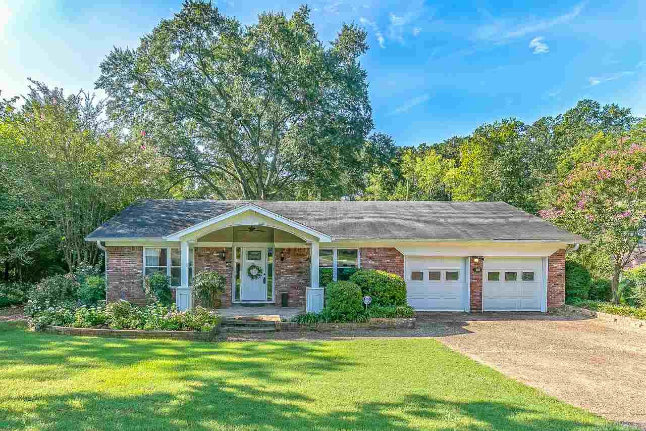 What a jewel! Wonderfully maintained with many updates and great storage. New Gourmet Kitchen with new cabinets and slab granite counter tops, island with breakfast bar, stainless range and microwave. New windows and vinyl siding. New front porch. Gorgeous yard with landscaping. 3 Spacious bedrooms. Pretty hardwood floors. New Master Bathroom. Kitchen opens to den. Nice Living Room/Dining Room. Office/exercise room. Furnace 2012. Water Heater 2014. Great natural light. Close to shopping and restaurants.
