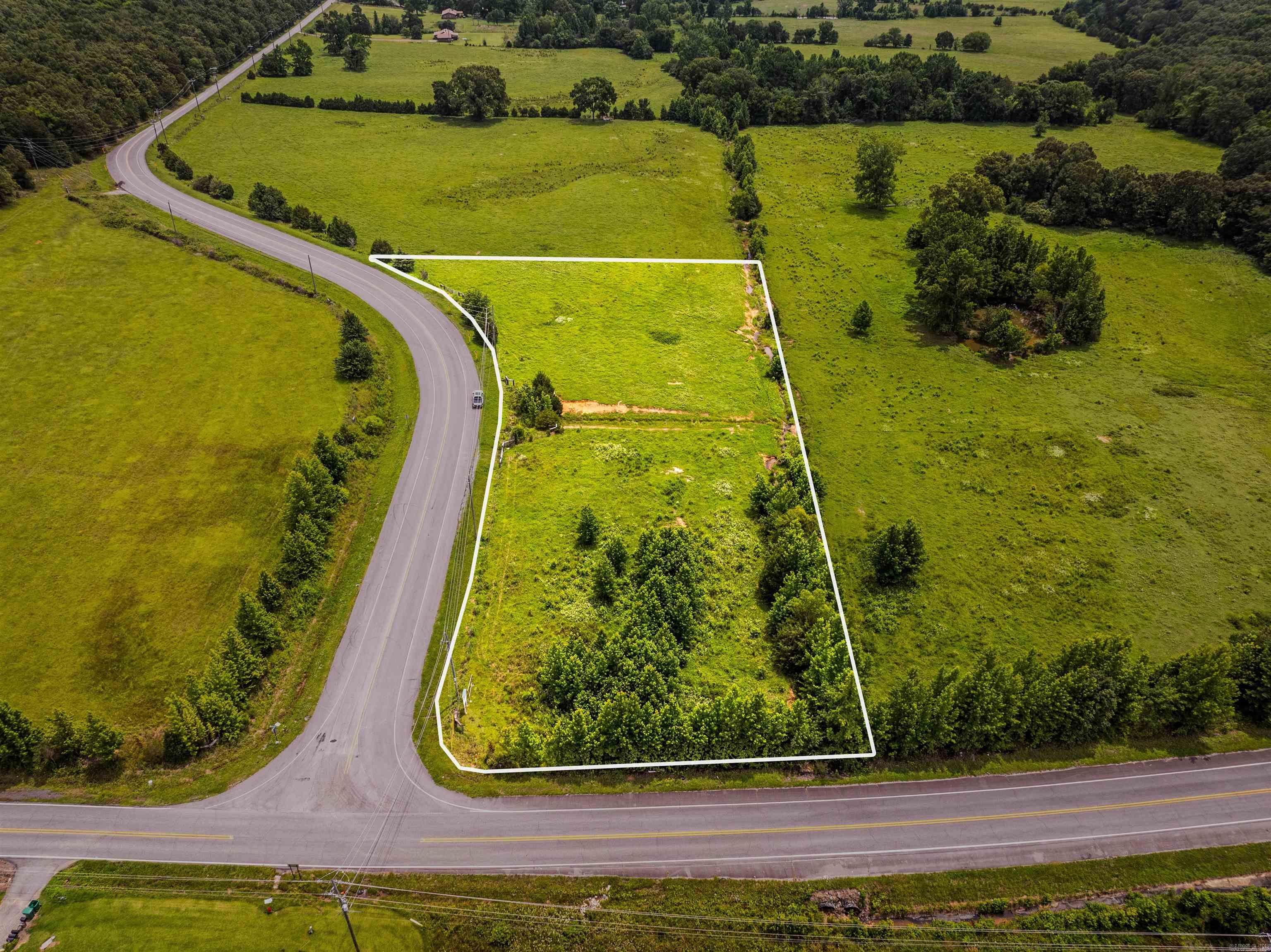 Escape the hustle and bustle without giving up convenience. This is Lot five of seven premium tracts of land we are offering, each three acres more or less with a blend of open fields and serene wooded areas-perfect settings for your dream home!  *Beautiful Building Sites  *Utilities Already in Place  *Percolation Tests Completed  These tracts are ready for you to build the lifestyle you've been envisioning. Don't miss the chance to secure your piece of peaceful living just minutes from the city