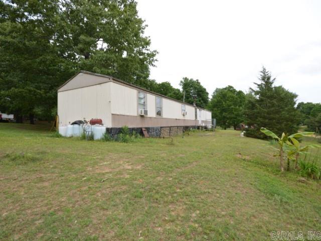 Mobile Home on 1 Acre of land. Unrestricted. POA fee $120 per year. Sells "As-Is." Three bedrooms and two full baths. Little shop utility shed. Sits on top of a ridge. Great yard area.
