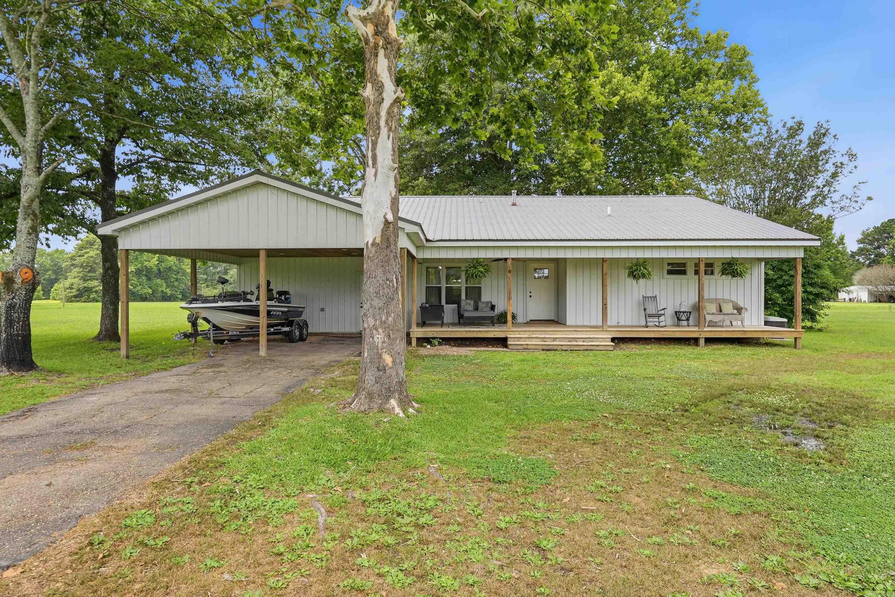 Welcome home to this beautifully renovated 4-bedroom, 2-bath home situated on 3 peaceful acres in the desirable Tull community. This move-in ready property offers the perfect blend of modern updates and country charm.  Inside, you’ll find fresh renovations throughout, including new flooring, updated light fixtures, and beautifully remodeled bathrooms. The spacious floor plan provides plenty of room for family living, entertaining, or working from home.  Step outside and enjoy the wide-open space, mature shade trees, and relaxing front porch—perfect for morning coffee or evening sunsets. The property also features covered parking and plenty of room for boats, RVs, animals, gardening, or future outbuildings.  If you’ve been searching for a turnkey home with acreage and room to breathe, this one is a must see!