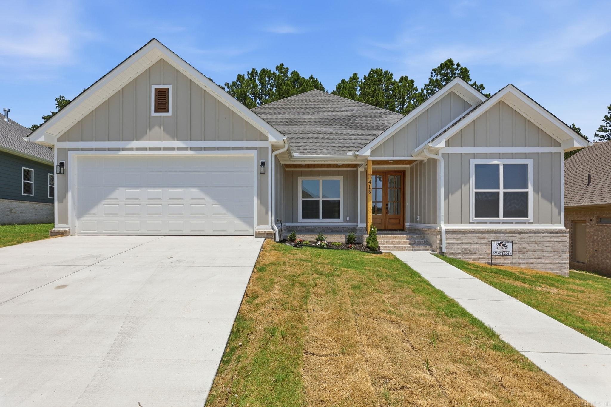 Take a look at this beautiful Craftsman-style home situated in a highly sought-after neighborhood in Bryant! You'll find custom designer touches throughout the residence, creating a perfect mix of elegance and functionality. Its excellent location also means you're just a short walk away from the neighborhood pool.  This home boasts a thoughtfully designed layout with an open kitchen and living room filled with natural light all while backing up to a secluded greenbelt.   Call listing agent to see it today.