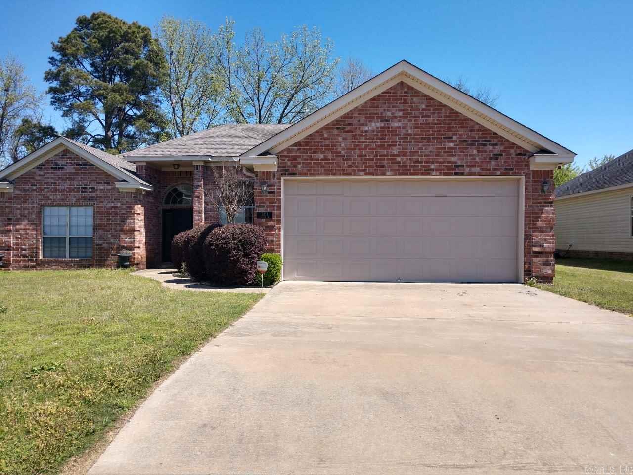 Great 4 BR, home is in the heart of Bryant, Newly painted, new tile in dining room and kitchen, new tile counter tops in kitchen and bathrooms, new blinds, wood burning fireplace, 2 car garage, don't miss out on this home!