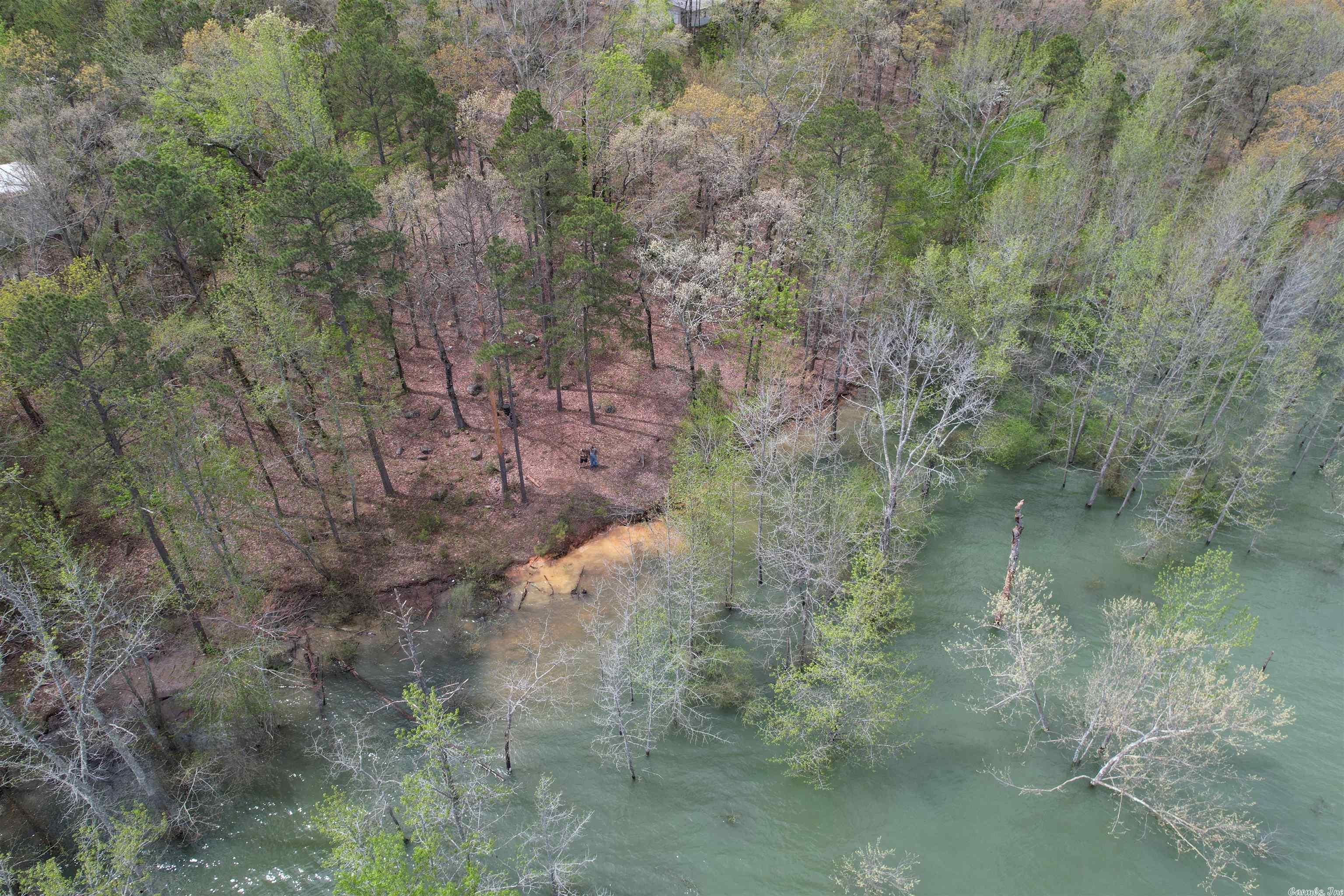 A MUST SEE!!! This is a rare find on this Lake front Acreage with no restrictions, The lot has been Perk tested, Surveyed and has a Power & Water.  This Lot offers an amazing view of Greers Ferry Lake in the Cove Creek area, you can literally park your boat and walk to your back porch. The lot has some clearing and leveling started for your dream home, also there is a storage shed that conveys with the purchase.