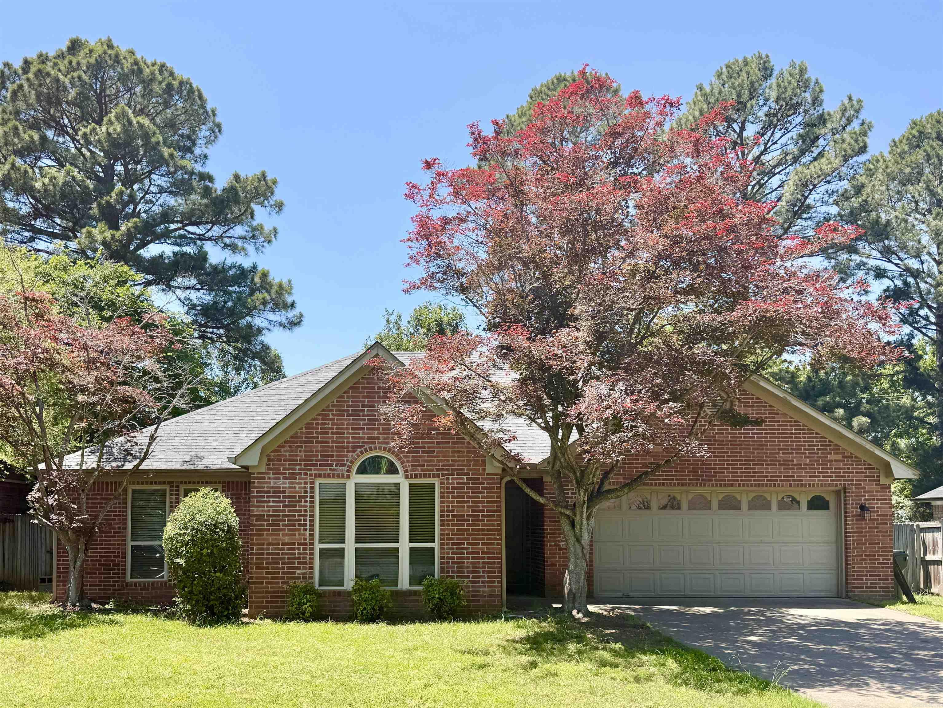 Welcome to this charming 3-bedroom, 2-bath home in a highly desirable college town location.  Perfect for faculty, students, families or investors.  This home has room for the new owner to add their personal touch. The inviting layout features spacious living and dining areas flowing into the kitchen complete with a stainless refrigerator and new disposal. The oversized primary suite provides space for a sitting area or home office and offers direct backyard access.  Enjoy the fully fenced private backyard, ideal for relaxing or entertaining.  Two additional bedrooms offer flexibility for guests or workspace needs.  Major updates include a 2024 roof and 2021 Trane HVAC with warranty!  Carpet has been pulled up since photos were taken.  Installation of new carpet is happening 1st week in Jun.