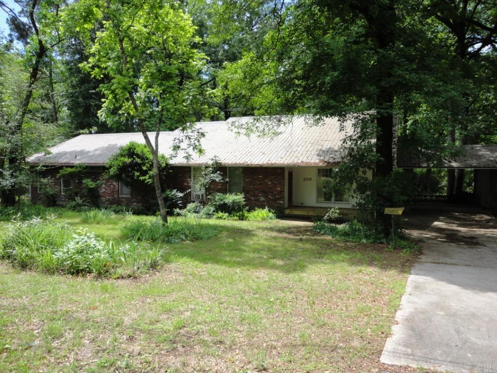 Just Listed: Custom-Built Retreat on 1+ Acre – Limitless Potential! For the first time, this original-owner masterpiece is available. Spanning over 4,000 sq. ft. and featuring a metal roof, this expansive home offers incredible flexibility for 6-bedroom potential. Plus, a lush acre-plus lot features a massive shop with a metal roof, concrete floor, and full 120v/220v wiring—perfect for hobbies or gear. The heart of the home is an oversized eat-in kitchen featuring a cozy wood-burning fireplace, complemented by a formal dining room. The thoughtful layout includes 4 main-level bedrooms & 3 full baths, while the upstairs offers two versatile spaces perfect for an additional 2 bedrooms or massive bonus rooms and a 1/2 bath. Work from home in the dedicated office/craft space and enjoy abundant storage, including deep closets and a walk-out attic. (Note: seller is also offering additional lots for sale separately at the rear of the property/ square footage, year built, & acreage based on tax record information)