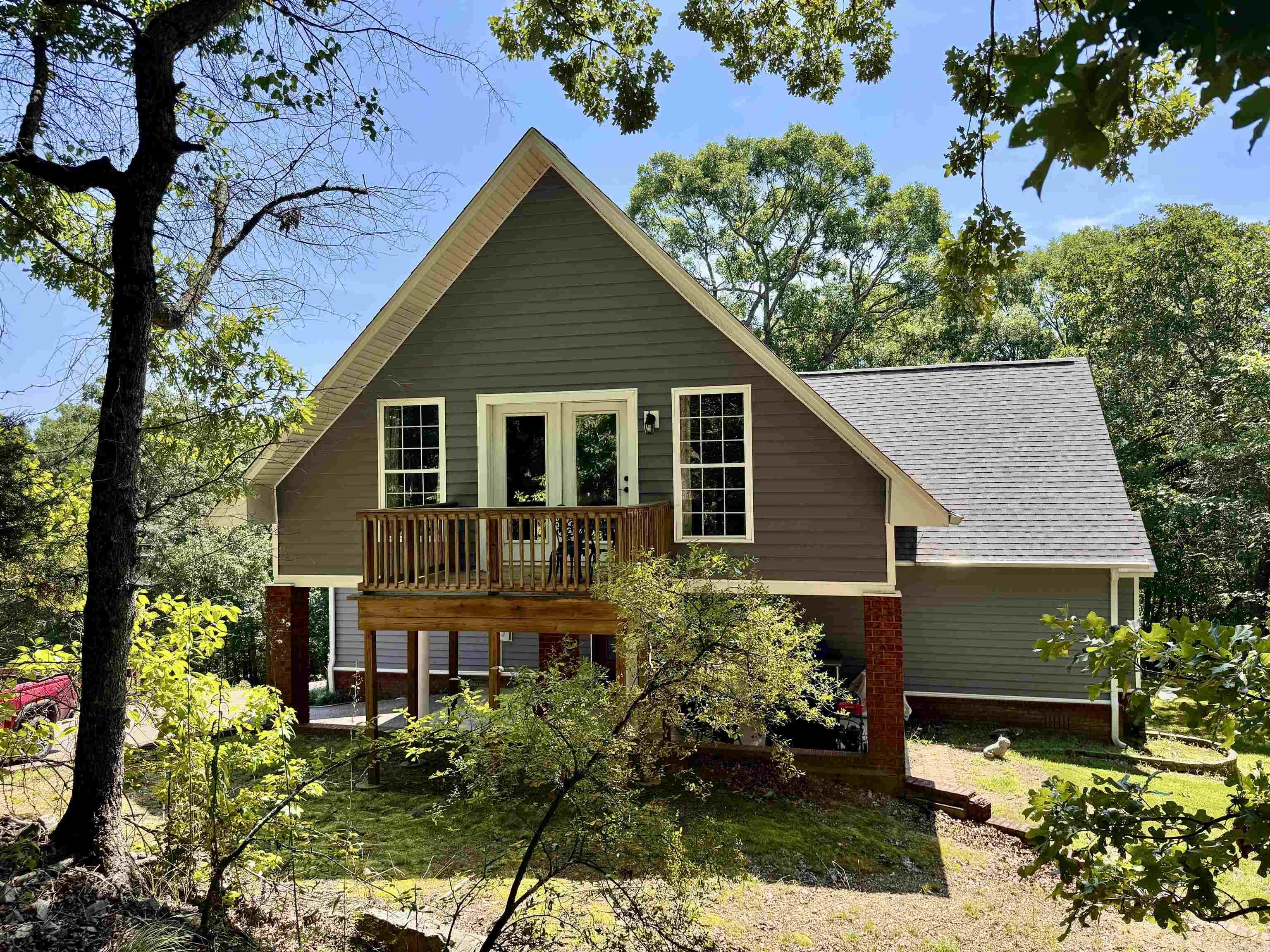 Meticulously maintained and move-in ready, this exceptional 3/2.5 home showcases quality craftsmanship and thoughtful updates throughout. When you are not spoiling yourself with the luxury interior, you can enjoy the scenic 5 acres by sitting on your elevated deck and taking in the vista views overlooking Hot Springs. Recent updates include a new roof and HVAC units, extra blown-in insulation in the attic, R-19 batts of insulation in the floors, a crawl space vapor barrier, and much more. The barn is lofted for extra storage and has a new metal roof.