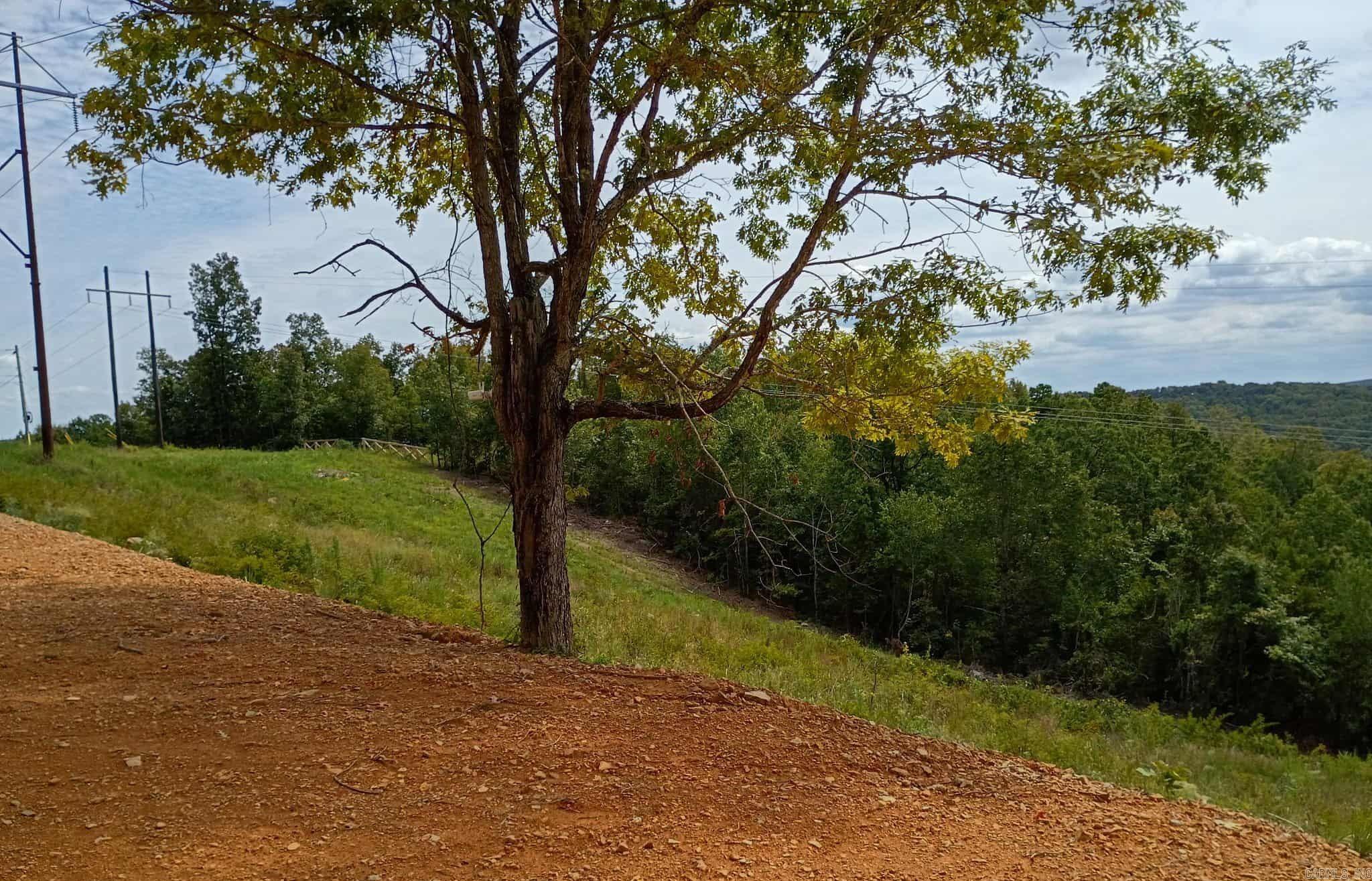 Beautiful mountain views, especially of Clinton at night. Close to popular UTV trails in Fairfield Bay & Greer’s Ferry Lake. Large area cleared & leveled for a house or camper. No restrictions, survey on file, utilities at road.