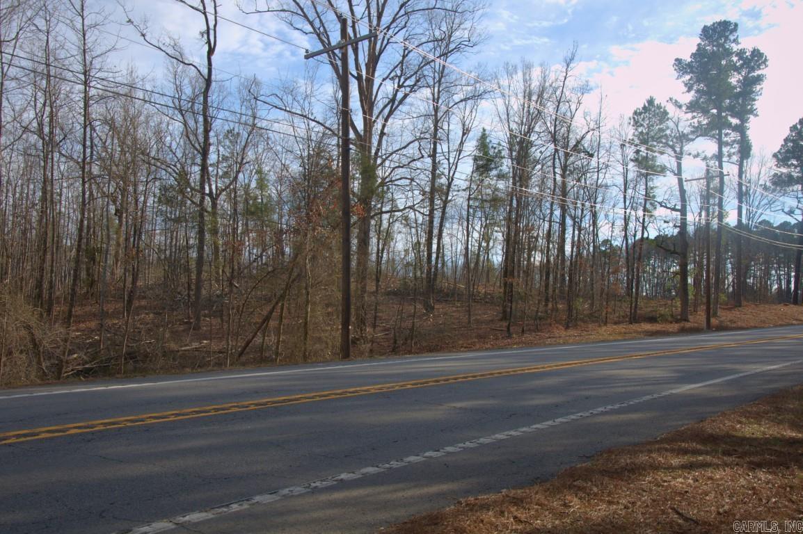 Discover 40 acres of prime potential, perfect for your new home, housing development, or commercial venture! Nestled amidst rolling hills, this property boasts approximately 1,200 sq ft of prime Highway 5 frontage. Recent timber thinning enhances the potential for seamless new construction. Rest easy knowing this gem is not in a flood zone, according to cityhs.net. Located outside the city, enjoy the tranquility while still having essential amenities—water and electricity conveniently available at the road.