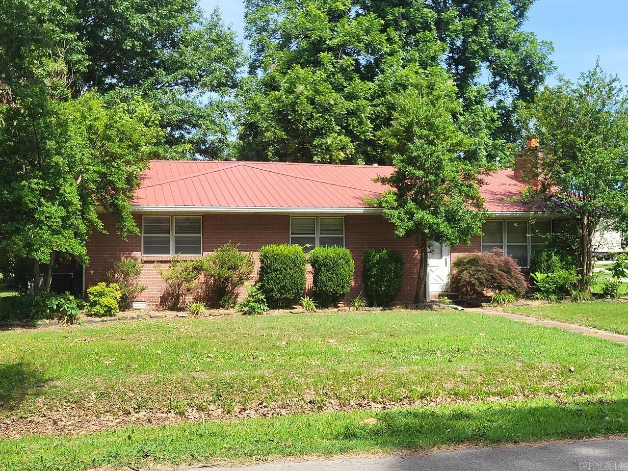 There is a lot of potential in this large 3 bedroom, 2 bath brick home in Hoxie! It features 2 living areas, a separate dining area, a big unfinished basement that's approxmately 15'x30' with 8 foot ceilings, and a large storage room that's approximately 6'x21'. Double corner lot with small storage shed out back and a 2 car carport with additional parking space on the side.