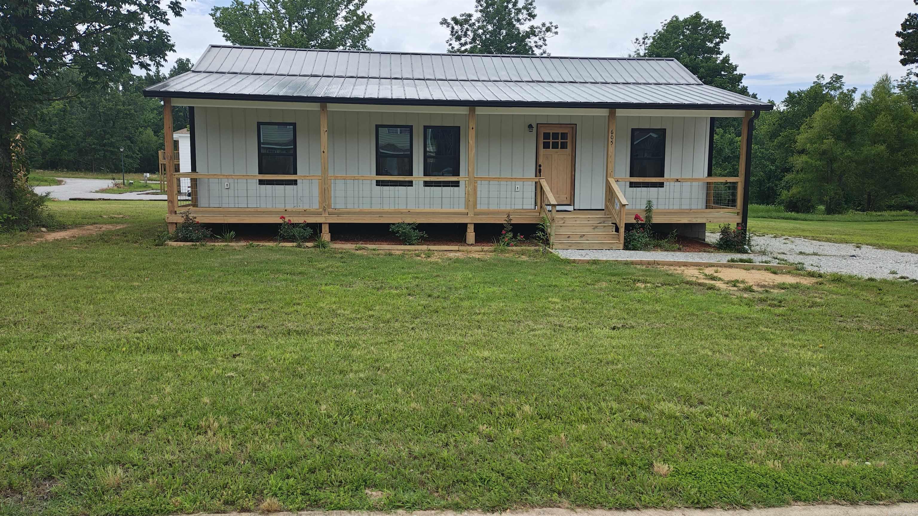 This is a brand-new 3-bedroom, 2-bathroom home offering almost 1,300 square feet under roof in the heart of the Ozarks! Located in a quiet neighborhood in Mountain View, this property sits on nearly ½ acre with no restrictions — giving you plenty of space to build a garage, carport, workshop, or simply enjoy the extra room.  Enjoy the best of both worlds — peaceful living just minutes from shopping and restaurants, plus all the charm of downtown Mountain View’s music and local shops. Love the outdoors? You’re close to fishing, hiking, and hunting throughout the stunning Ozark Mountains. This amazing house is move-in ready, and could be used for your forever home, summer getaway, or as a vacation rental.  Built with Thermatech energy-efficient products, this home is designed to keep utility bills low while keeping you warm in the winter and cool in the summer. By using non-toxic building materials, a healthier living environment is achieved. Engineered for strength and stability, this home is built to withstand the elements.