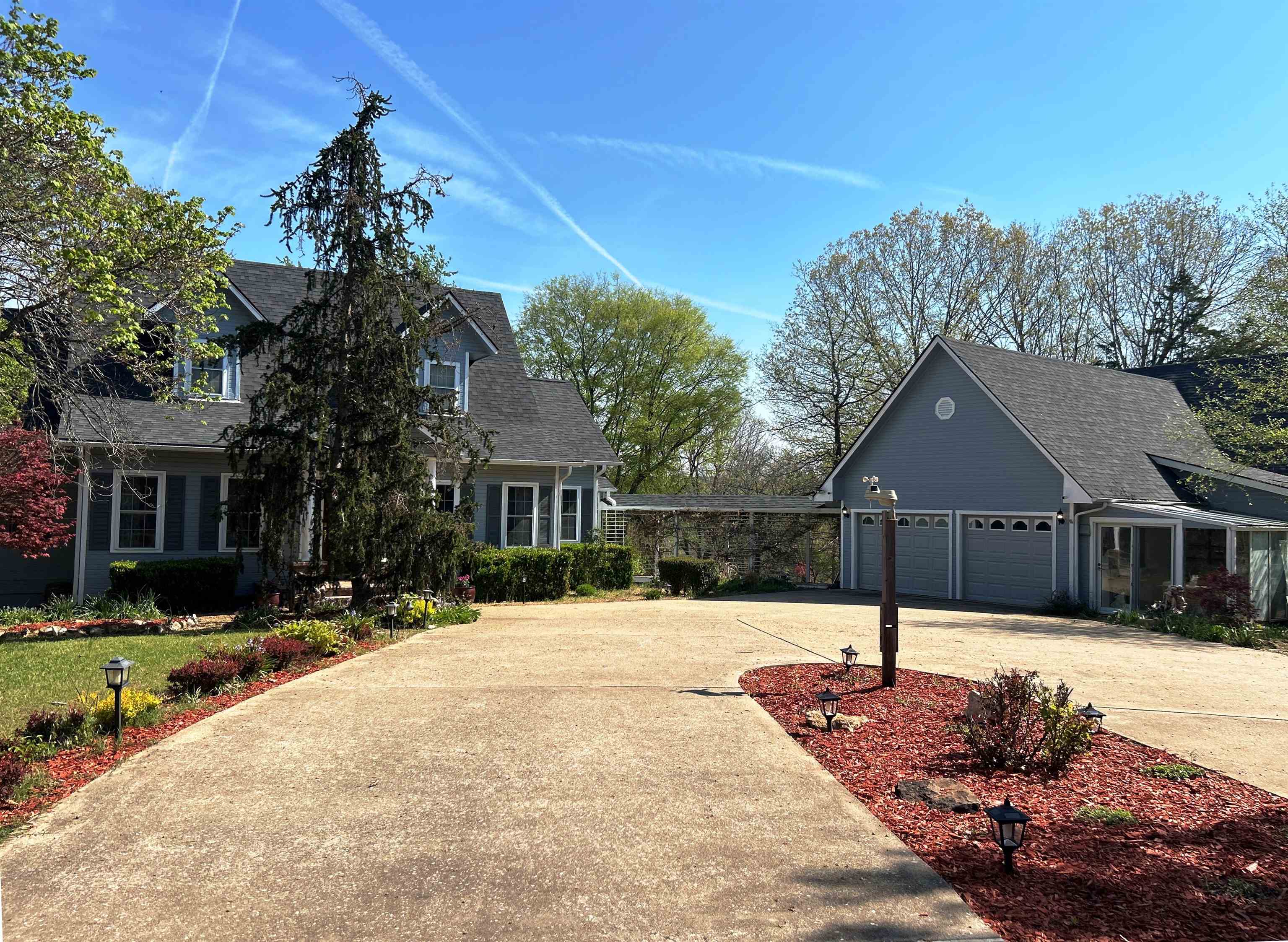 Country estate on the golf course in Cherokee Village, AR! Situated on 2.72 beautifully landscaped acres overlooking the 4th green of the North Golf Course, this spacious home offers luxury, comfort, and room for everyone. Featuring bedrooms on all three levels, including a main-level master suite with heated floors, jetted tub, and custom shower. The home boasts 9 ft ceilings, a formal dining room, and a large kitchen with dinette area. Upstairs includes 2 bedrooms and 1 bath, while the finished basement offers an additional bedroom, bath, game room with gas log fireplace, living area, and office—ideal for multi-generational living or entertaining. Extras include humidfier plumbed into main level HVAC, Lots of buit-ins, buffet in kitchen plumbed for a sink.   Outside, enjoy multiple shops and outbuildings, including a 4-bay shop/garage with ¾ bath, plus an additional shop for storage and a small greenhouse. Relax and take in the scenic golf course views from the backyard, complete with extensive landscaping, a waterfall, and koi pond. A rare opportunity combining space, amenities, and a prime golf course location!