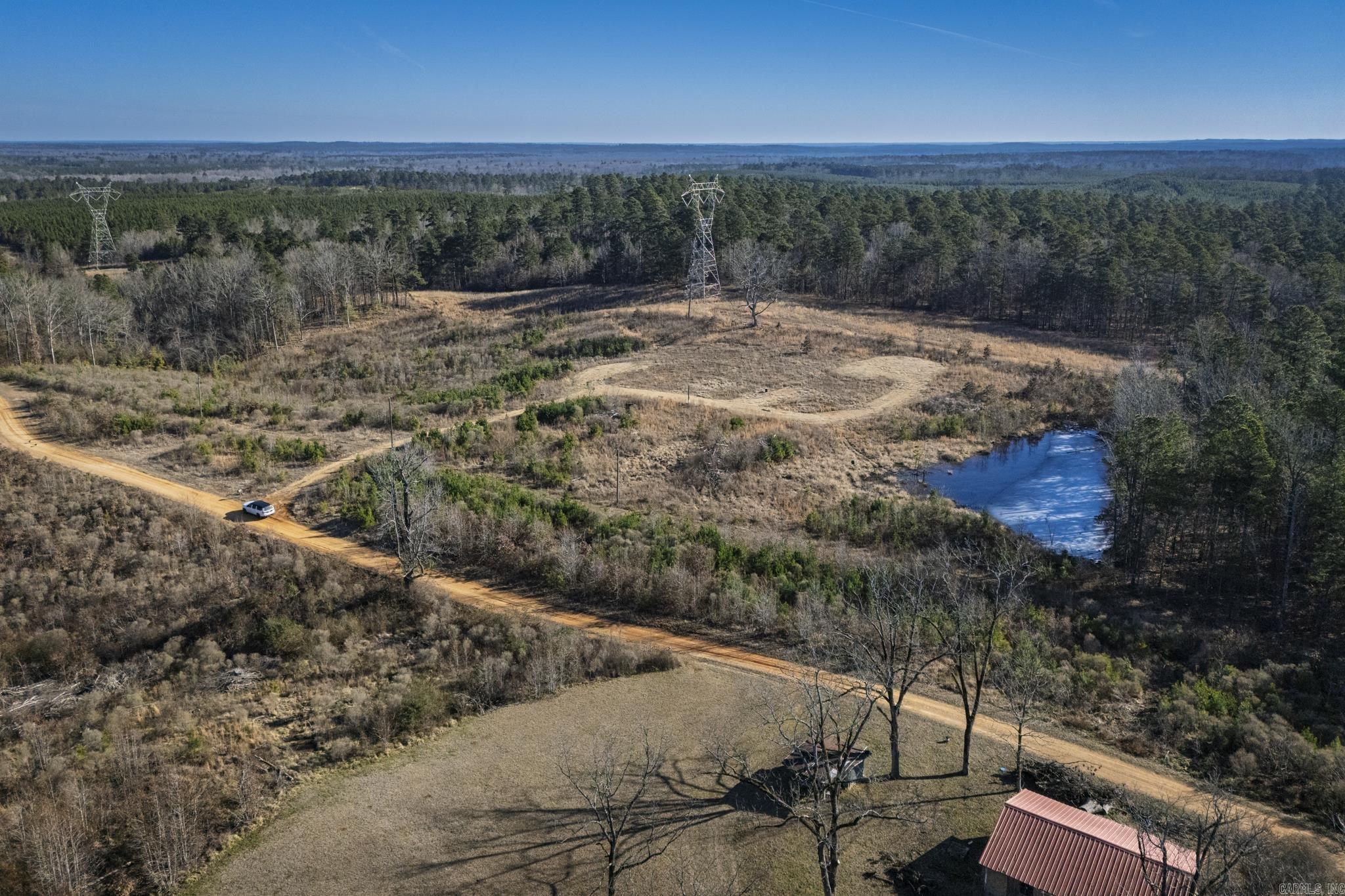 Beautiful 9-acre property located at 58 Dodgen Rd in Gurdon, AR, offering the perfect blend of open space, natural scenery, and ready-to-build convenience. Electric and water are already on site, making this an excellent opportunity for a future homesite, weekend getaway, or recreational retreat.  The front portion of the land is mostly flat and easily accessible, while the back half gently slopes into a wooded area with a peaceful view overlooking the surrounding landscape. A shared pond with the neighboring property adds charm and outdoor enjoyment, creating a serene country setting just minutes from town.  Whether you’re looking to build, invest, or simply enjoy quiet acreage, this property offers space, privacy, and beautiful natural surroundings. Call today for more details or to schedule a showing.