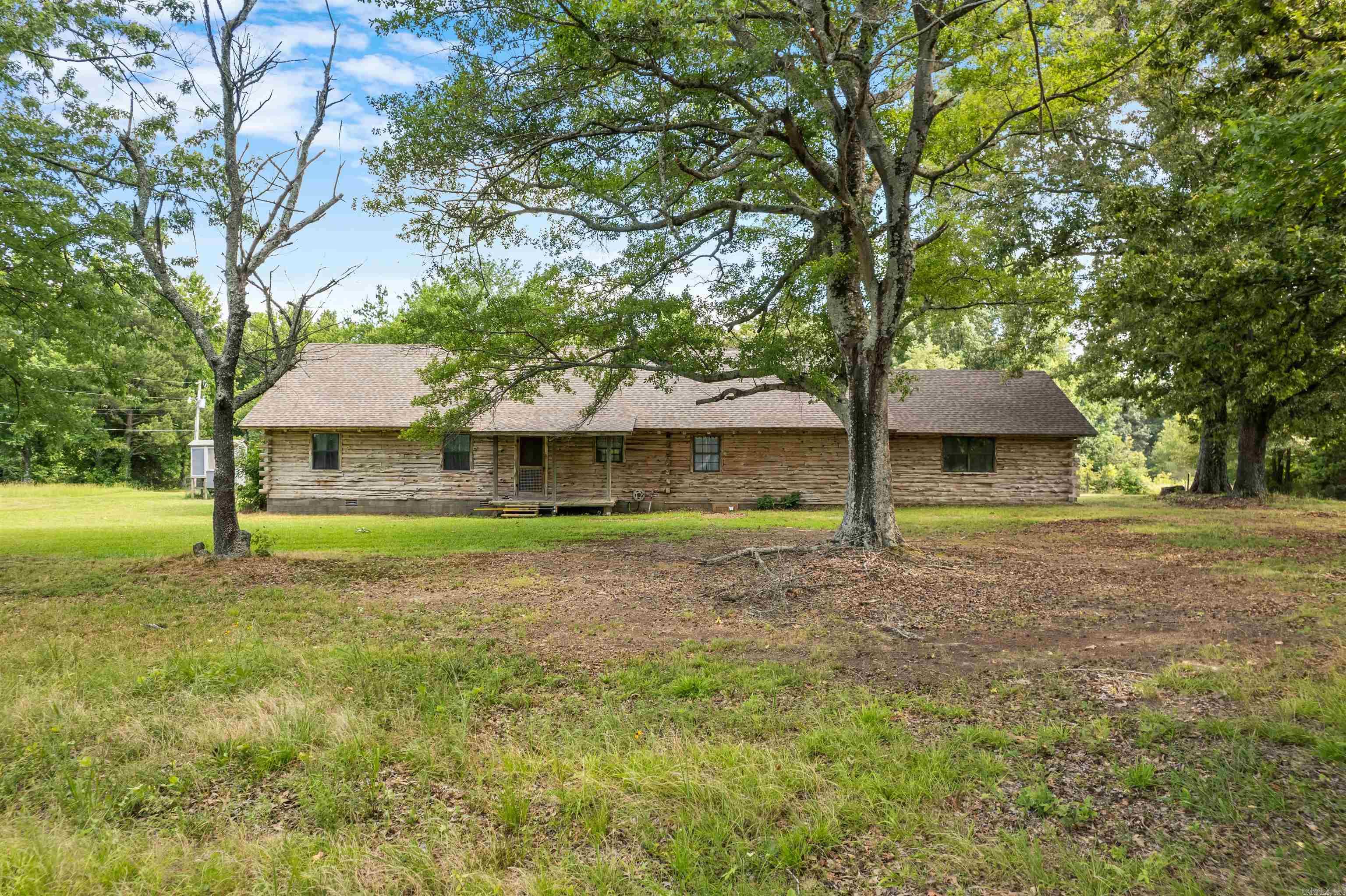 Want your own little farm? Take a look at this cedar log home sitting on 10 acres. Features 3 beds, 3 baths, a loft and a barn. Home has had some updates inside. Roof and HVAC approximately 7 years old. New garage door coming soon. Property sits just outside of Cabot city limits. Country living with city conveniences. Call now to schedule a showing.