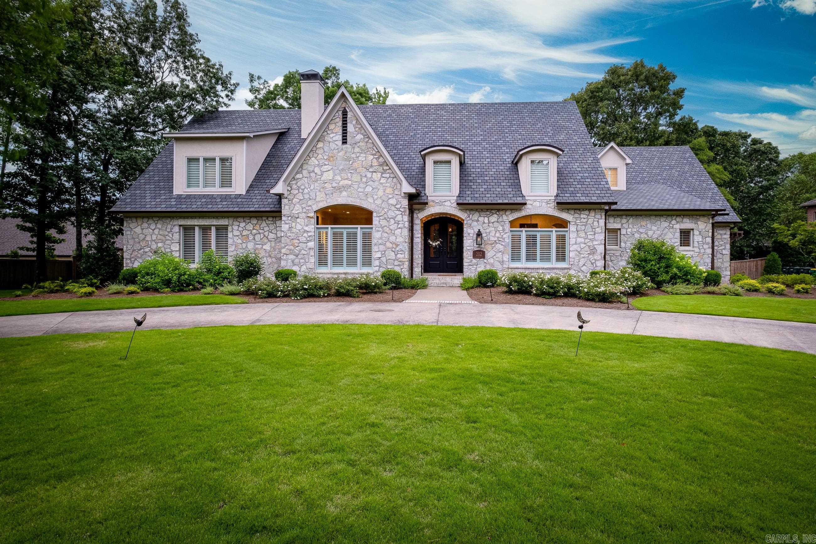Spectacular home in the gated Sologne Circle neighborhood. This home was taken down to the studs in 2021 & everything from exterior to interior has been updated. Beautiful hardwoods through out all living areas and bedrooms, designer lighting and finishes through out. The kitchen is a chef's dream with a impressive appliance package. Thermador dual professional range, side by side refrigerator/freezer, Miele built in coffee machine, sonic ice maker, wet bar w/ beverage fridge. Primary suite is immaculate with designer style closets, marble heated floors, marble shower & counters, soaking tub, beverage fridge/coffee bar. A guest suite down with private bathroom. Upstairs there are 2 more bedrooms with en-suites and a bonus room. On the other side of the home is a separate stair case leading to a 2nd primary suite, with a gorgeous bathroom complete with glass shower and soaking tub, walk in closet & beverage fridge. Perfect for parents or guests.  Large covered back porch w/ a outdoor kitchen that is a griller's dream. Thermador grill, beverage fridge, ice maker, sink and bar for seating. So many extras. See documents for a list of all features/updates. *Agents see Remarks*