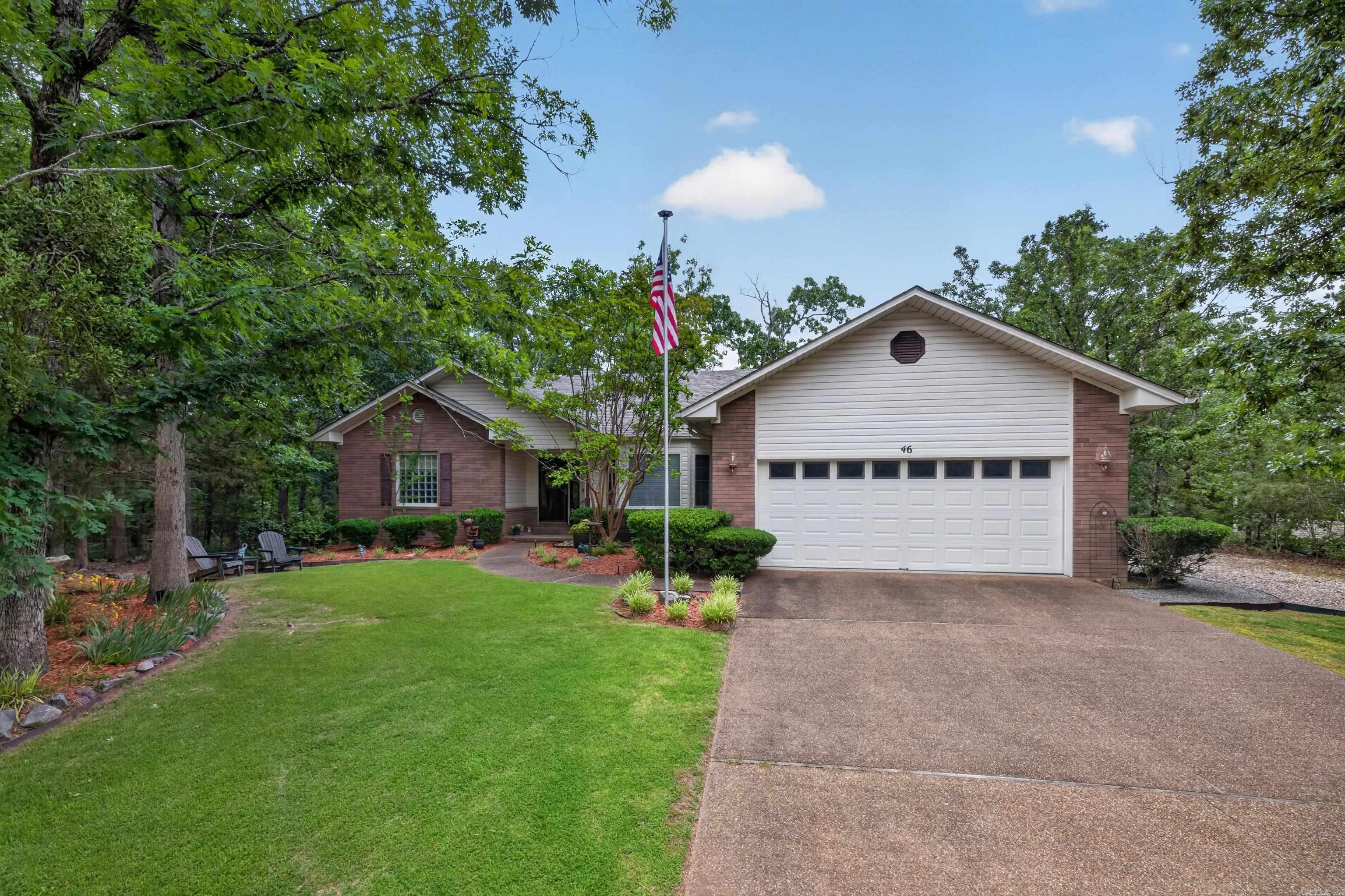 Spacious and exceptionally well-maintained home nestled in a peaceful, wooded setting in the desirable Lake Balboa neighborhood. This inviting floor plan offers generous living areas, a large great room with fireplace and built-in cabinetry, formal dining space, and a bright Arkansas room perfect for enjoying the natural surroundings year-round. The kitchen features abundant cabinetry, ample counter space, and a walk-in pantry for excellent storage. The oversized primary suite includes a large bath with double vanities, soaking tub, separate shower, and an impressive walk-in closet. Guests will appreciate the comfortable secondary bedrooms and spacious layout. Outside, enjoy mature landscaping, a private backyard, and a relaxing deck ideal for entertaining or unwinding. Roof replaced in 2025 with 40 year shingles, HVAC 2021 with transferable warranty. Water Heater 2025. Disposal/Faucets/Microwave/Stove replaced in 2023. Sprinkler system reworked in 2025. Propane tanks are leased. New home owners are subject to a one time HSV POA buy in fee of $2000 collected at closing. Conveniently located near golf, lakes, walking trails, and all the amenities Hot Springs Village has to offer.