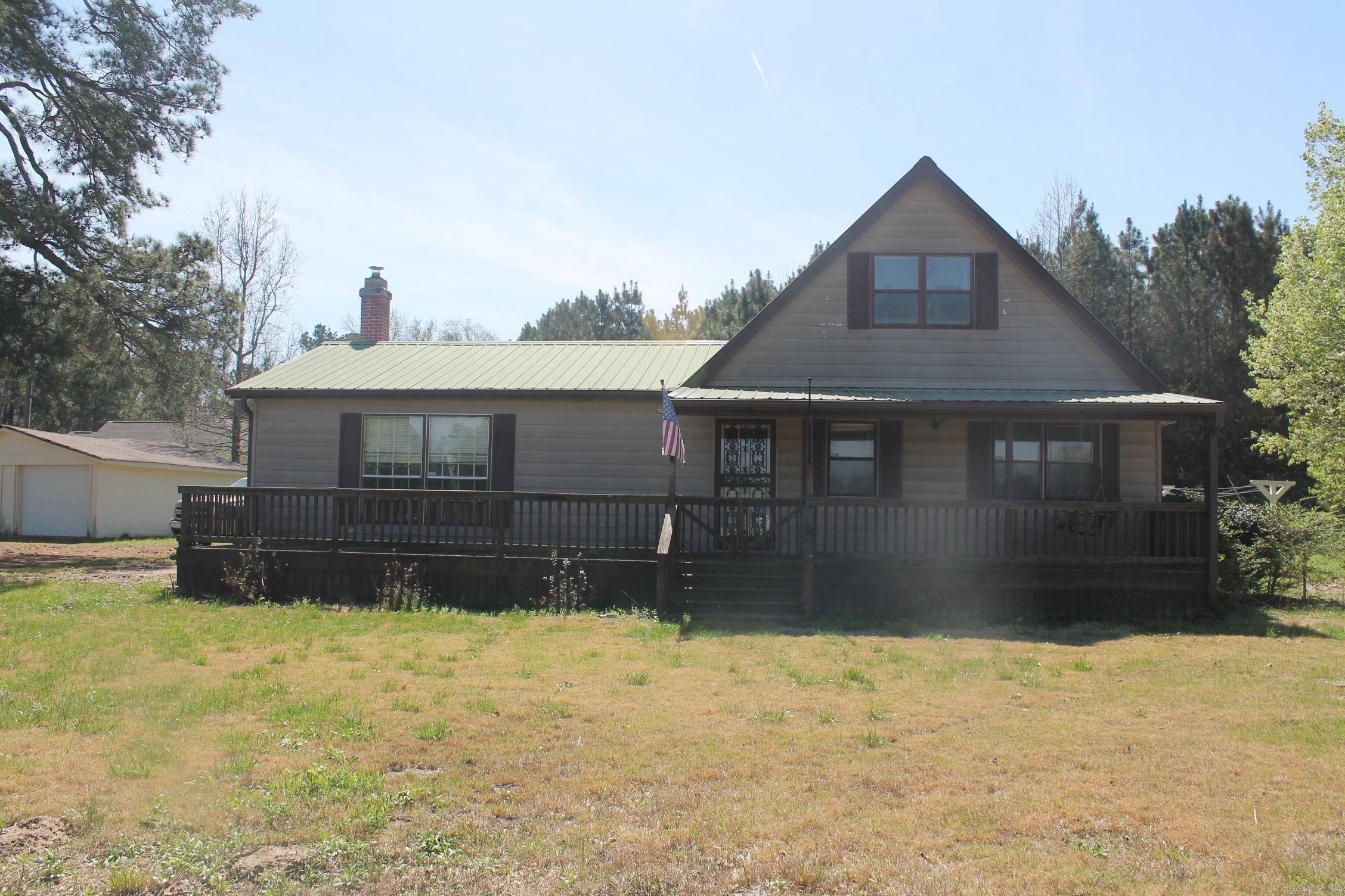 Nice country home with 3.32 acres. Nice front porch with screened in patio. Upstairs with room and a loft. Big living area. Walk in storm shelter. Green house and garden in back yard. Give me a call to see this one today. 8709410353