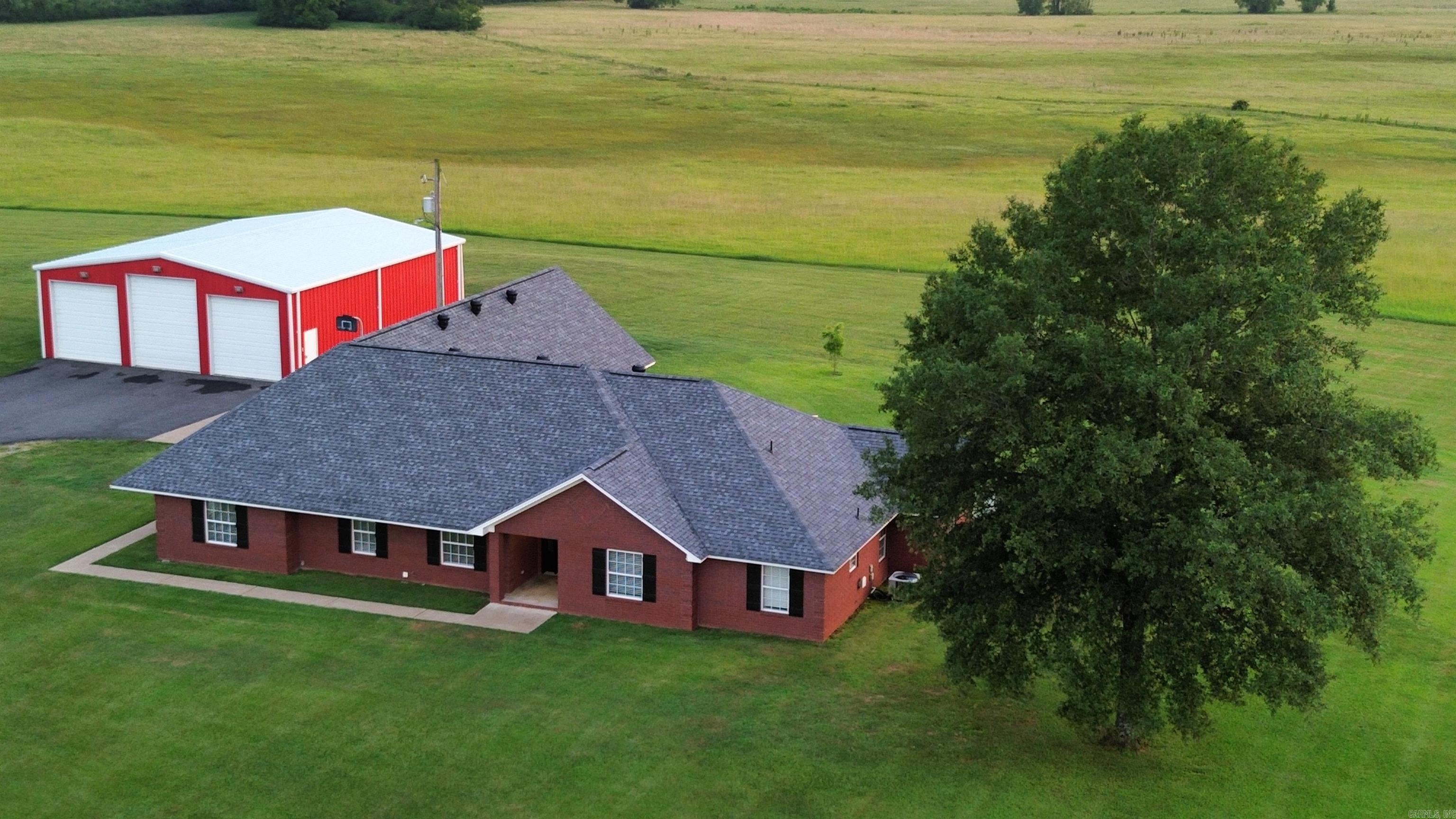 Welcome to this private country retreat! This beautiful 3,200± sq. ft. home sits on 16.02± beautiful acres and offers the perfect blend of comfort, space, and versatility. Featuring 4 bedrooms, 2.5 bathrooms, multiple living areas, and a whole-home generator, this well-maintained home is designed for both everyday living and entertaining. Need room for your projects or business? You'll love the impressive 44' x 50' heated and cooled shop—ideal for a workshop, equipment storage, hobbies, or a home-based business—plus a second shop for even more storage and workspace. Step outside and enjoy 16.02± acres of endless possibilities. Whether you dream of starting a hobby farm, gardening, riding ATVs, or simply relaxing and taking in the peaceful surroundings, this property gives you the freedom to create the lifestyle you've always wanted. There's plenty of room for additional buildings or future improvements. Conveniently located with easy access to Benton, Malvern, and surrounding communities, you'll enjoy the serenity of country living without sacrificing convenience.