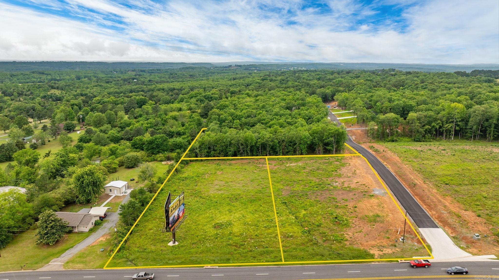 High Visibility location on Hwy 65 with a high traffic count. 6 acres total can be divided to 1 acre tracts or combine different amounts of land to suit your needs.  Outside of the city limits with no restrictions. Property is cleared and ready to build.