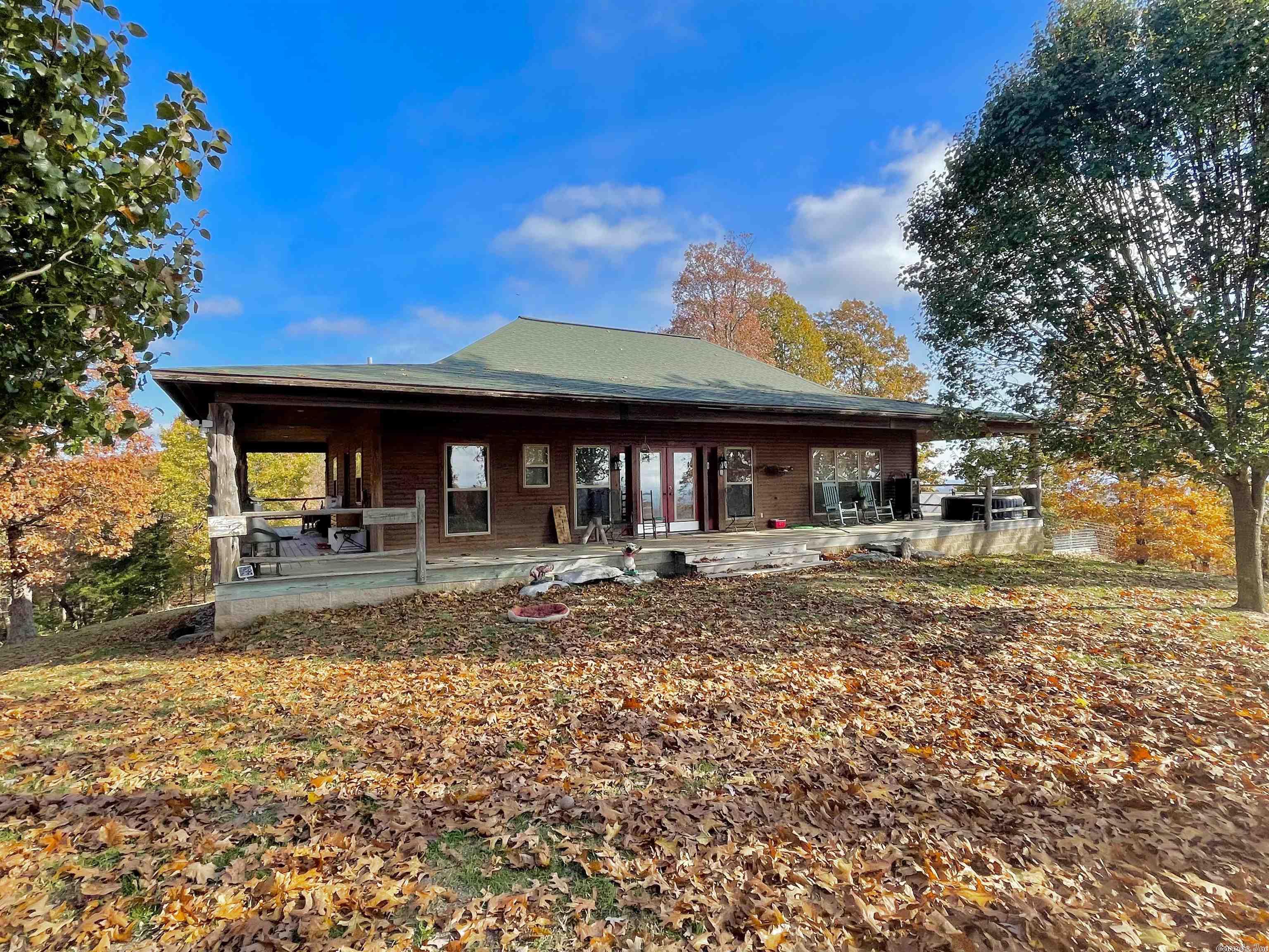 Large home on 190 acres with a breathtaking view!! This 3 bed/2.5 bath home offers an open kitchen/living area with the master suite on the main level. It has a full walk out basement with a second living area/game room, full bathroom, 2 guest bedrooms, & a safe room. The home has a wrap around porch with great views in all directions! The land is fully fenced with a mixture of pasture & timber, two ponds, ATV trails throughout the entire property, & a 36x72 barn with an enclosed shop area.