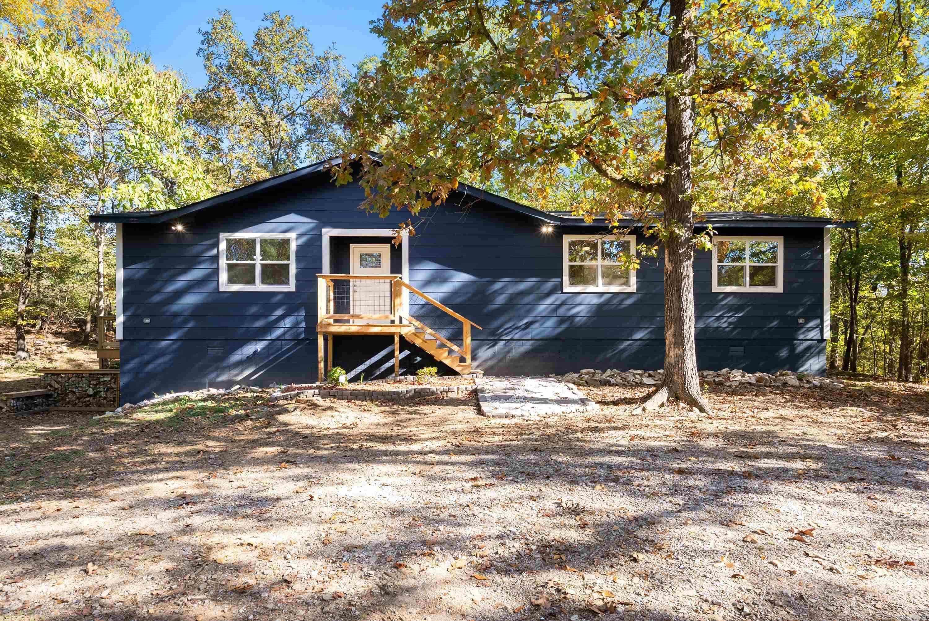 Your own private hilltop retreat awaits! Tucked away on 2.04 peaceful acres, this beautifully renovated home offers the ultimate in privacy and tranquility—perfect for those craving space, seclusion, and nature. With nearly every detail thoughtfully updated, this 3-bed, 2-bath home spans 1,444 sqft and truly feels like brand-new construction. Step inside and be wowed by the total transformation: stylish new flooring throughout, fresh paint, modern light fixtures & ceiling fans, completely updated bathrooms, new appliances, sleek countertops, eye-catching backsplash, new windows, doors and roof with 2 brand-new decks ideal for relaxing or entertaining while surrounded by nature. You really have to see it to believe it! The property’s secluded setting makes it an excellent opportunity for investors as well as a fantastic AirBNB or VRBO getaway for guests looking to unplug and unwind in Hot Springs. Please note, the entrance to the property does include a low water bridge, adding to the rustic charm and private appeal. If you’re looking for a move-in-ready home with the feeling of a personal escape—or a high-potential short-term rental—this one checks all the boxes.