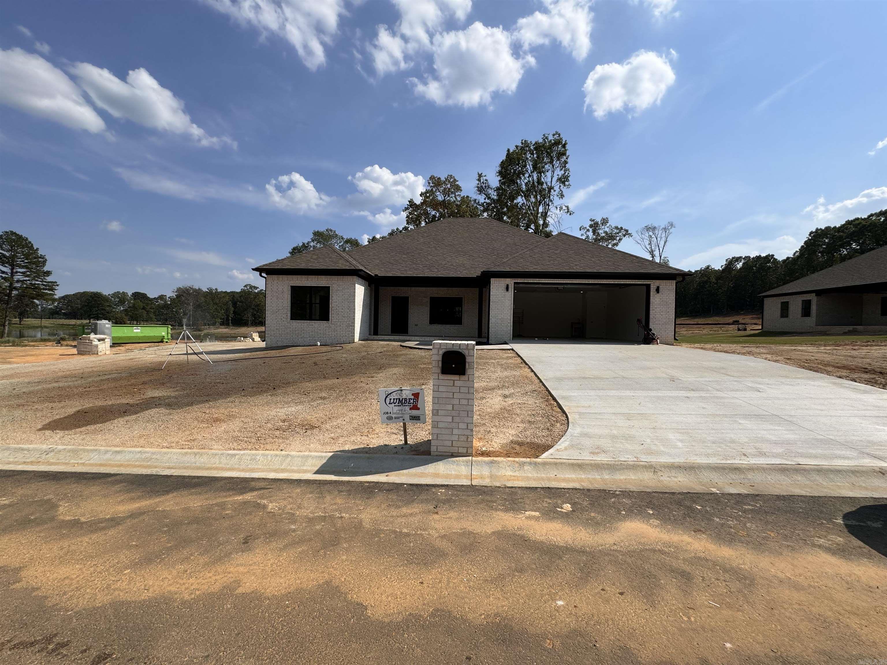 The new construction home features an open floor plan with 1800 sq feet of living space. It includes 3 bedrooms and 2 bathrooms. The layout allows for seamless flow between the kitchen, dining, and living areas. The bedrooms are spacious and offer plenty of natural light. Modern and stylish fixtures. This home
