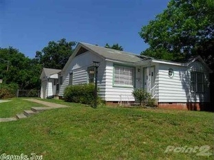 New Roof!!  This home has great street appeal and has hardwood flooring throughout with the exception of tile in the kitchen and baths.  Arched doorways, private patio, fenced yard. The garage has been converted to a third bedroom and full bath with laundry hookups. Great location within two blocks of UAMS.