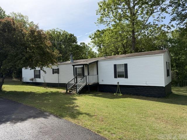Well maintained mobile home on 2.50 acres right outside heber Springs.  Three bedroom and 2 bath with covered back porch and carport cover.