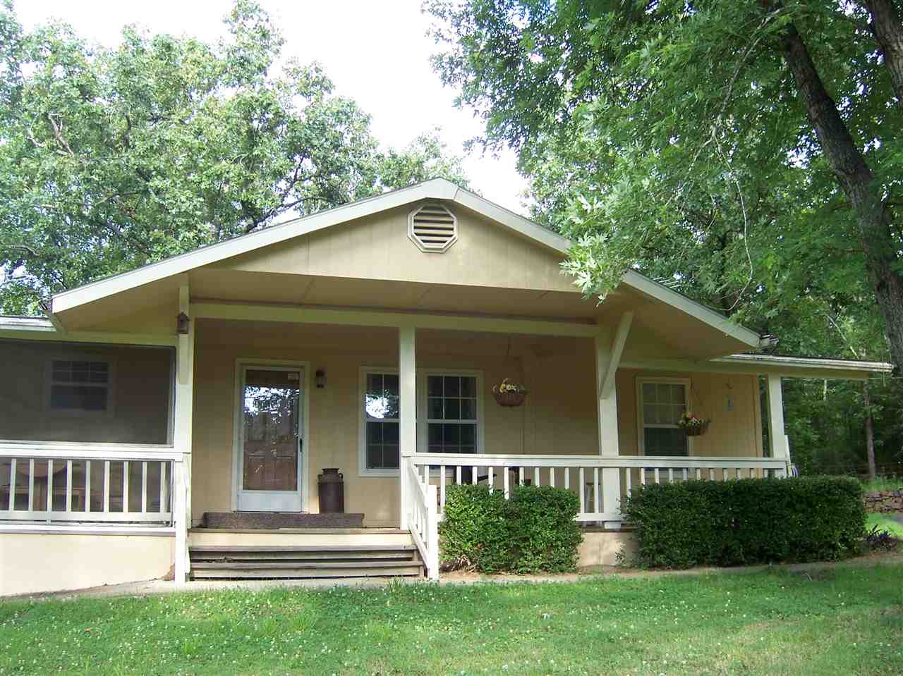 10 minutes from Conway you will arrive at your private space tucked away in nature's arms. 600 ft vaulted ceiling great room, deck on side entrance & back of home, long covered screened-in & open porch w/easy accessibility via a wheelchair. 2 baths have walk-in showers. Fresh/newer interior of home that makes it feel brand new! Lots of storage inside & out. Private space-great for bird-watchers. Vinyl Low-E windows, 2 fireplaces-both propane, & service set up for generator. (See agent remarks.)