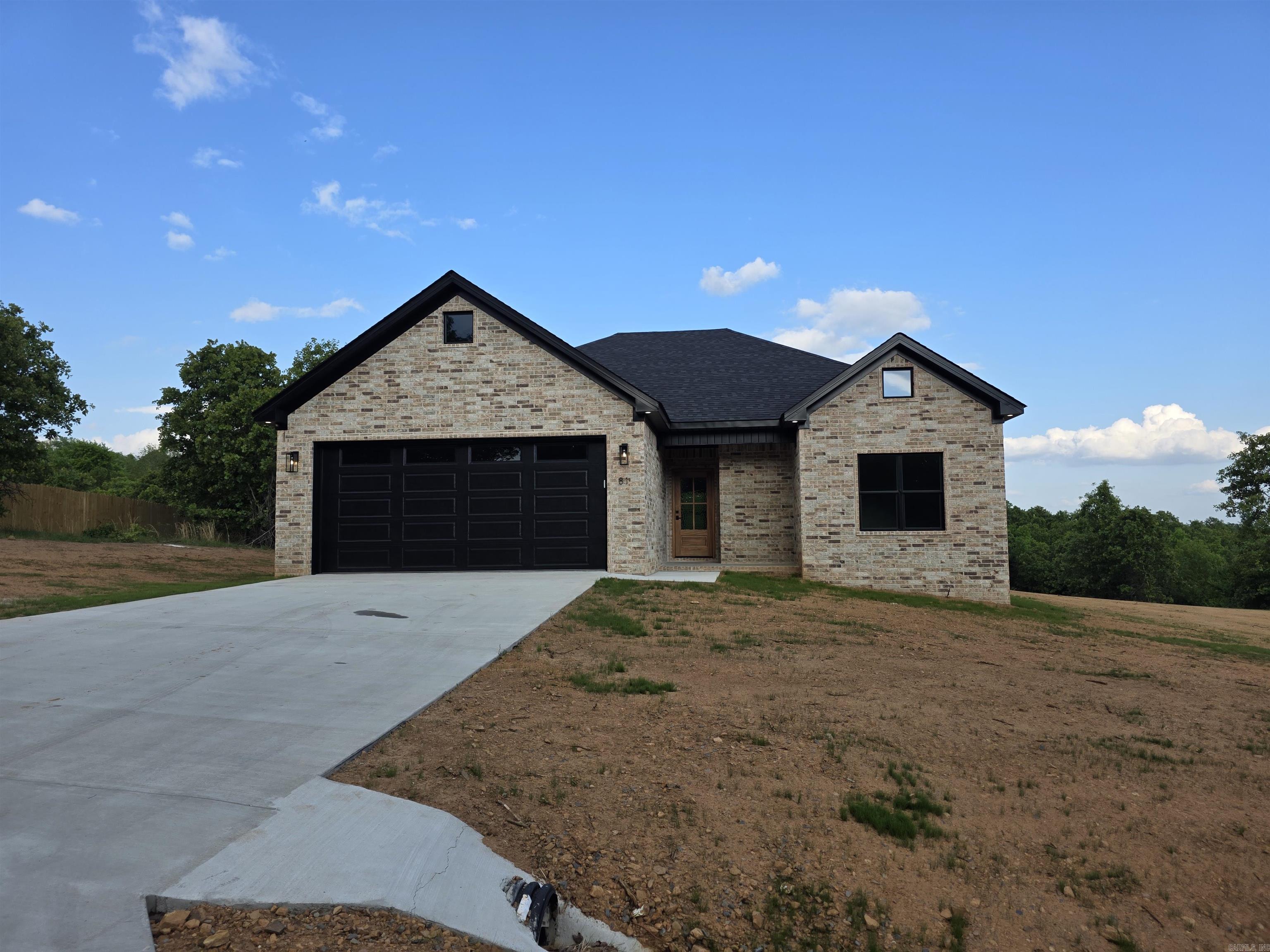 Welcome home to this beautiful new construction!! Located just outside Greenbrier, you will enjoy peaceful living with the convenience of being only minutes from shopping, dining, schools, and an easy commute to Conway. This home features an open- concept floor plan with luxury vinyl flooring, quartz countertops throughout, under cabinet lighting, a spacious kitchen with a corner pantry, and abundant natural light. The vaulted ceiling in the great room and tray ceiling in the primary suite add character and elegance, while the split bedroom layout offers privacy for family and guests. Every bedroom includes a walk-in closet, and the primary suite features two separate closets for exceptional storage. Motion senor lighting in multiple areas of the home adds a nice luxury and convivence touch. Move in ready and built with quality finishes, this home is the perfect blend of modern style, comfort, and everyday functionality.