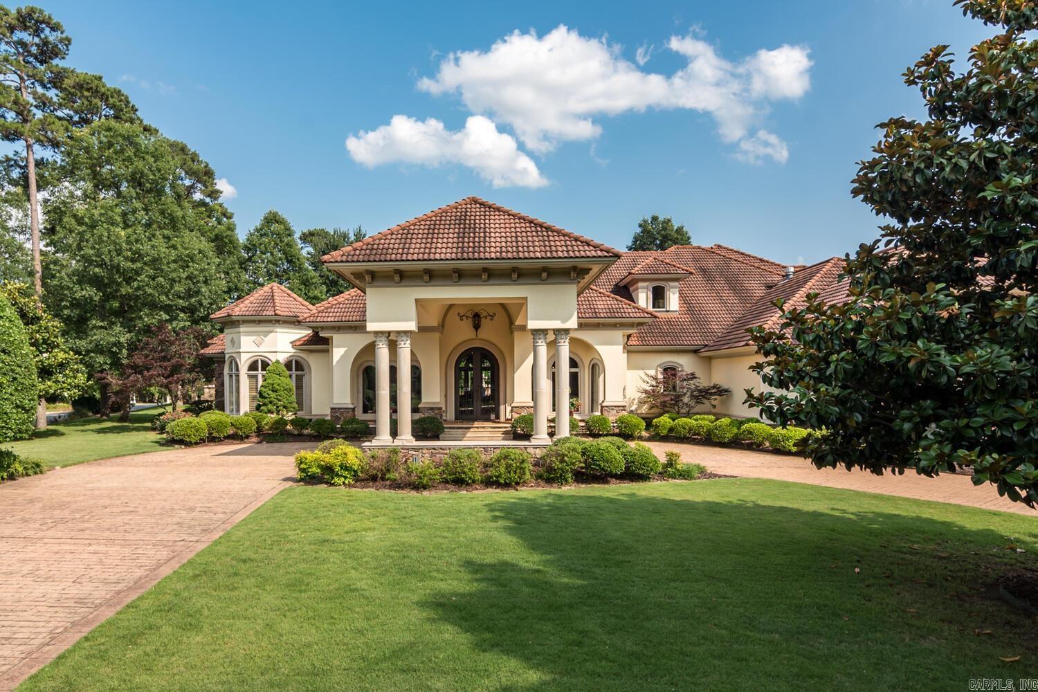 The private, gated entrance of Sologne introduces the superb tone of this Mediterranean estate on over an acre in this enclave of Chenal’s most important homes. Achieving an ideal balance of scale, symmetry and grandiosity, this custom-built estate is a work of art.  Effortlessly blending Mediterranean influences and craftsmanship with modern style, its unique aesthetic impresses at every turn. Statement details come from the Seller’s extensive travels include chandeliers from Prague, carved marble fireplaces, exotic onyx, and marble from around the world.  While the home boast over 6332 square feet, over 5000 square feet is on the main level.   The main level features the: foyer, formal dining, formal great room, study, two powder bath, owners’ suite, kitchen, informal dining, wet bar, informal great room, wine room and two additional bedroom suites.  The upstairs features a bedroom suite and flex space for a game room, wrapping area or a fifth bedroom and bath. The impressive 1.15 acre “park like” grounds feature a fabulous fountain, covered and uncovered terraces, all overlooking the professionally landscaped grounds, encased on all sides by a rock and iron wall.  APPTS REQUIRED