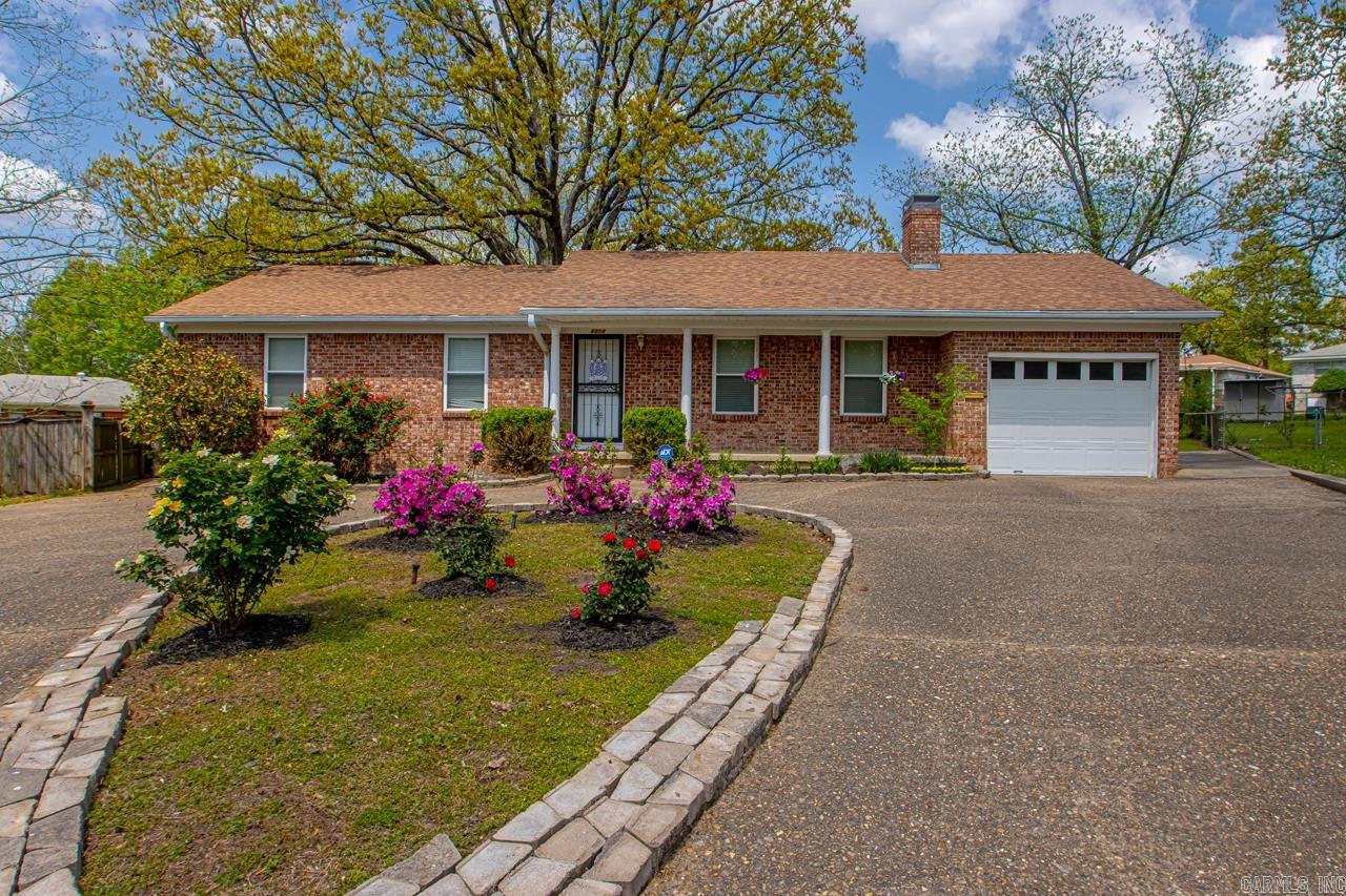 Check out this beautiful home in Midtown!  It's close and convenient to shopping, restaurants and hospitals!  Located on a quiet cul-de-sac with plenty of parking with the circle driveway and one car garage.  Beautiful landscaping front and back on this large .79 acre lot.  This home has plenty of space on the inside!  There is a formal living room/dining area, remodeled kitchen with a breakfast area and the master bath has been completely remodeled.  Step down in to a large living/den area to hang out.  The original hardwood floors still look great in the living room, hallway and bedrooms.  There is a large laundry room off the breakfast area.  Enjoy a large patio with plenty of space to relax and entertain.  A new roof is scheduled to be put on soon.  The windows are all vinyl.  Agents see remarks!